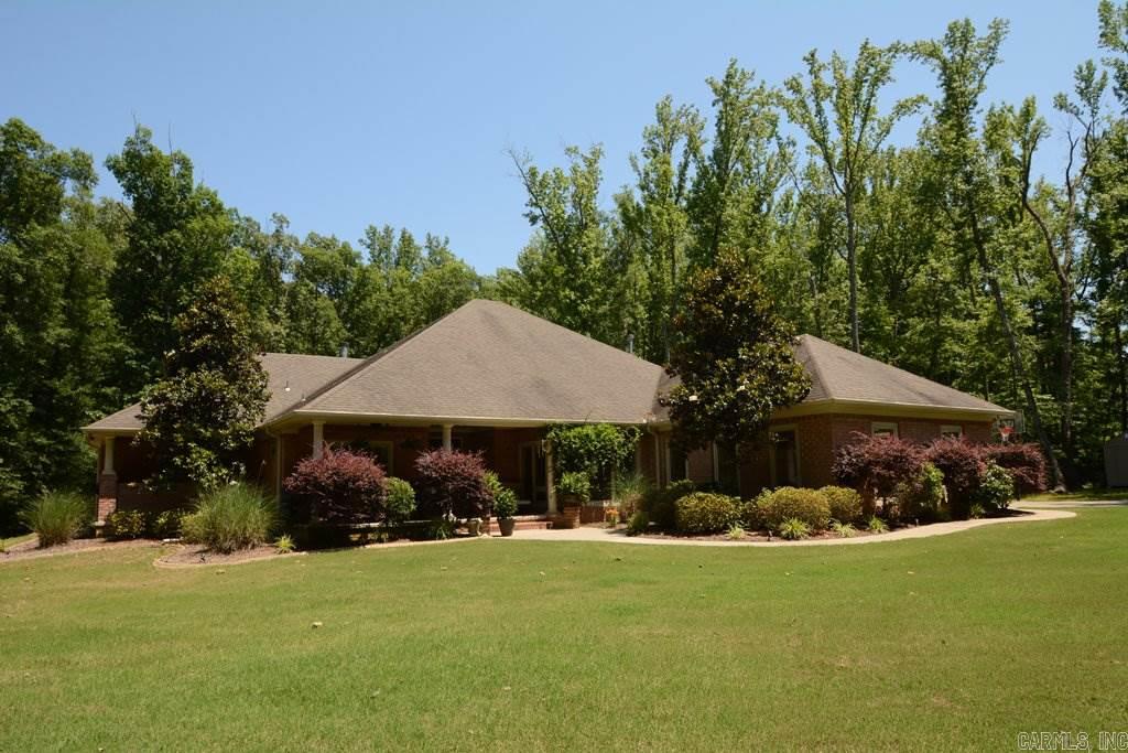 Perfect seclusion just south of Cabot. Tucked away on a private 3 acre lot surrounded by trees. Great 4 BR split plan with Jack and Jill set up on one side. Guest bedroom with full 3rd bath on the other. Master suite to die for with private covered porch. Perfect plan for entertaining with huge living area open to kitchen. Contemporary Kitchen with flat panel maple cabinets with brushed nickel wire pulls. Lots of roll out shelves. Kitchenaid appliances. Double Convection ovens. New dishwasher. Much More!!!