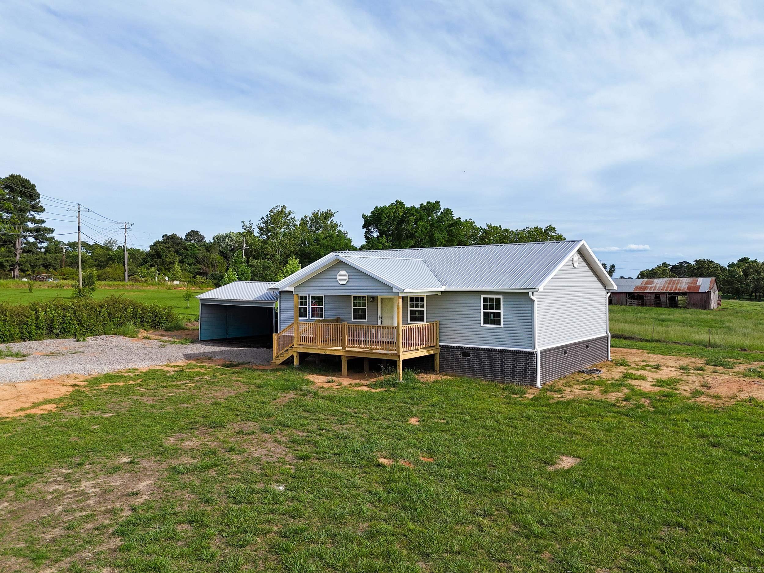 This new construction home offers 3 bedrooms and 2 bathrooms on a 1.16-acre lot, combining rural living with the convenience of a short drive to town. This home also features a 2-car carport. Inside, you’ll appreciate the split floor plan, designed for both comfort and privacy. The home features stylish finishes, modern flooring, and an abundance of natural light that enhances the bright, open living space. A clean, neutral color palette provides the perfect canvas to make it your own. Don’t miss the opportunity to make this home yours, schedule your private showing with me today!