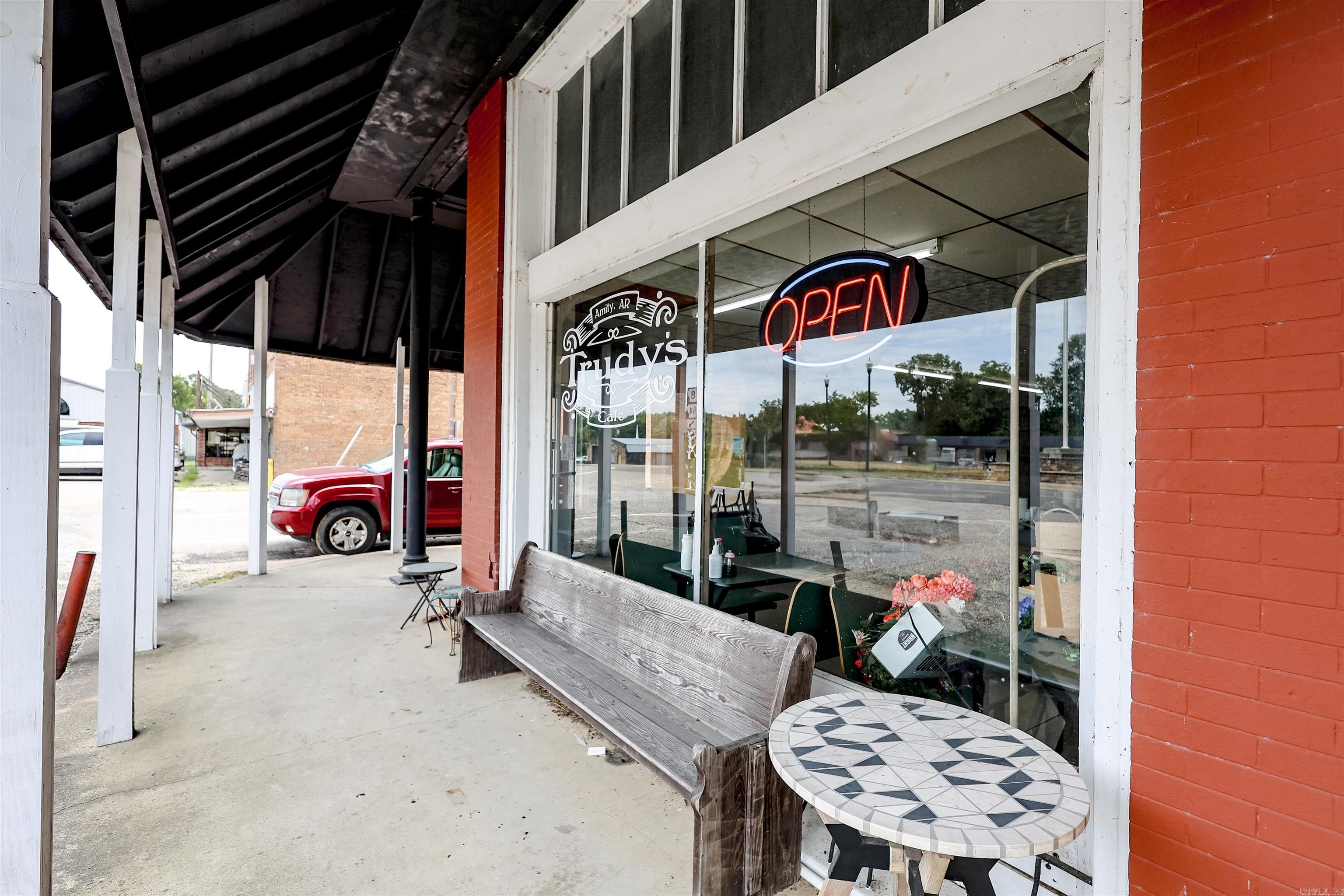 Don’t miss this exceptional opportunity to own a brick commercial building in the heart of Amity’s charming city square! This property boasts a long-term lease in place with a successful restaurant tenant, ensuring immediate income for investors. With high visibility and steady foot traffic, this location offers both stability and future potential. Whether you're expanding your portfolio or seeking a solid income-producing asset, this downtown gem is a smart move.