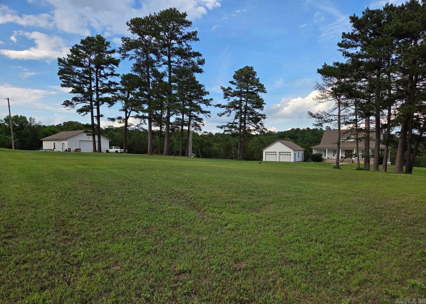 Discover exceptional craftsmanship in this well-built home featuring 2x6 construction making electric bills less then $130 a month, finished walkout basement, and 60 scenic acres with stunning panoramic views. Land has a nice sized pond and is fenced ready for your livestock, Inside the home boasts a chef's kitchen, dedicated laundry, and an inviting main floor living room. The main-level primary suite offers convenience, while two additional bedrooms and two large bonus rooms provide flexible space for guests, offices, or hobbies. The lower level also includes a spacious second living room, and is already plumbed for a lower kitchen sink. Outside, enjoy an insulated 30 X 40 shop with electric and concrete floors--ideal for projects or storage--along with a 26 X 30 detached 2-car garage.