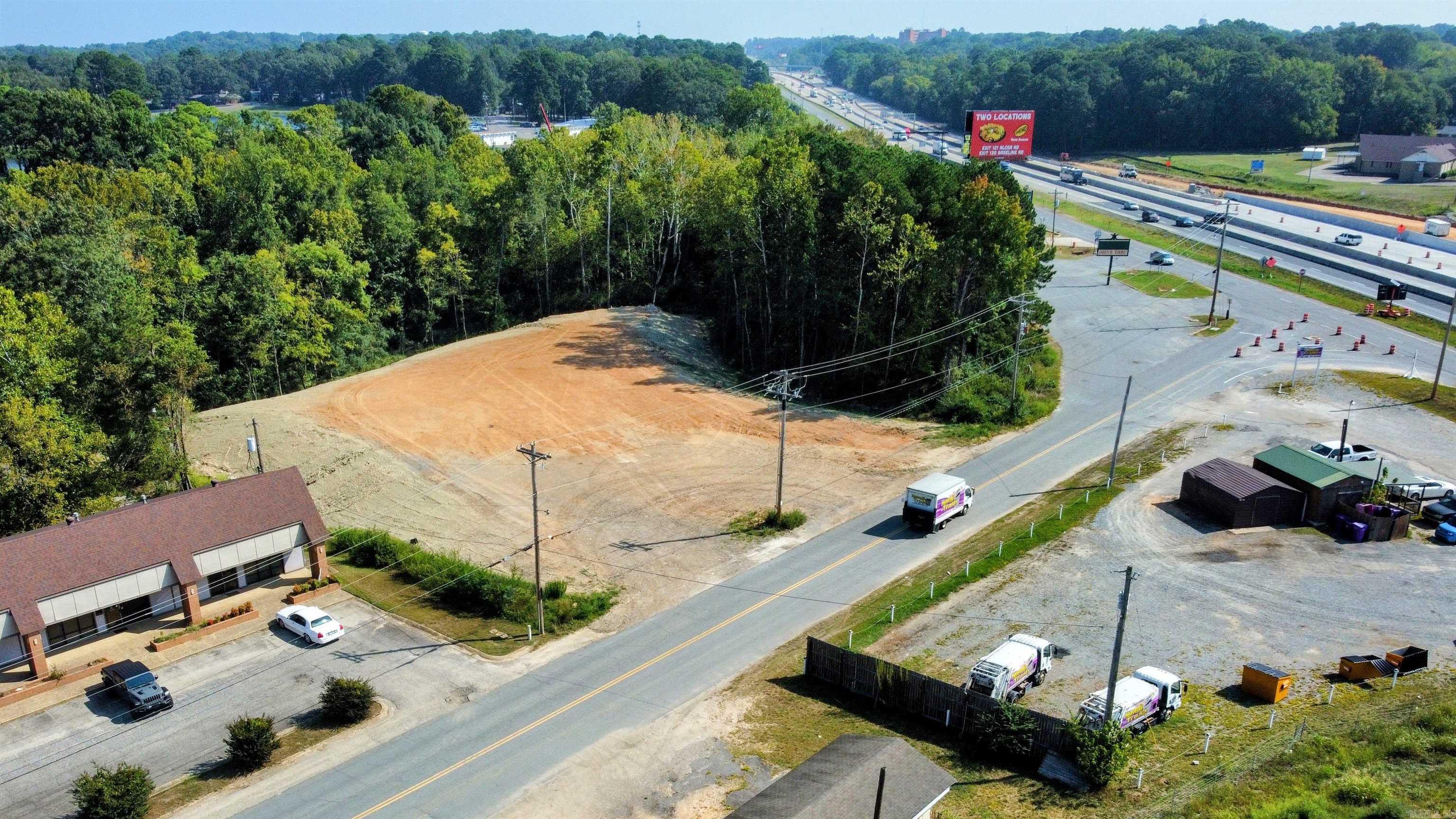 Prime Commercial! Great Visibility from I-30 and Service Road. Steps from Caldwell Elementary. The property has recently been cleared, partially filled, smoothed, and ready for your business! Drawings and Survey online for reference purposes only. Pad area is approximately 0.79 Acres.