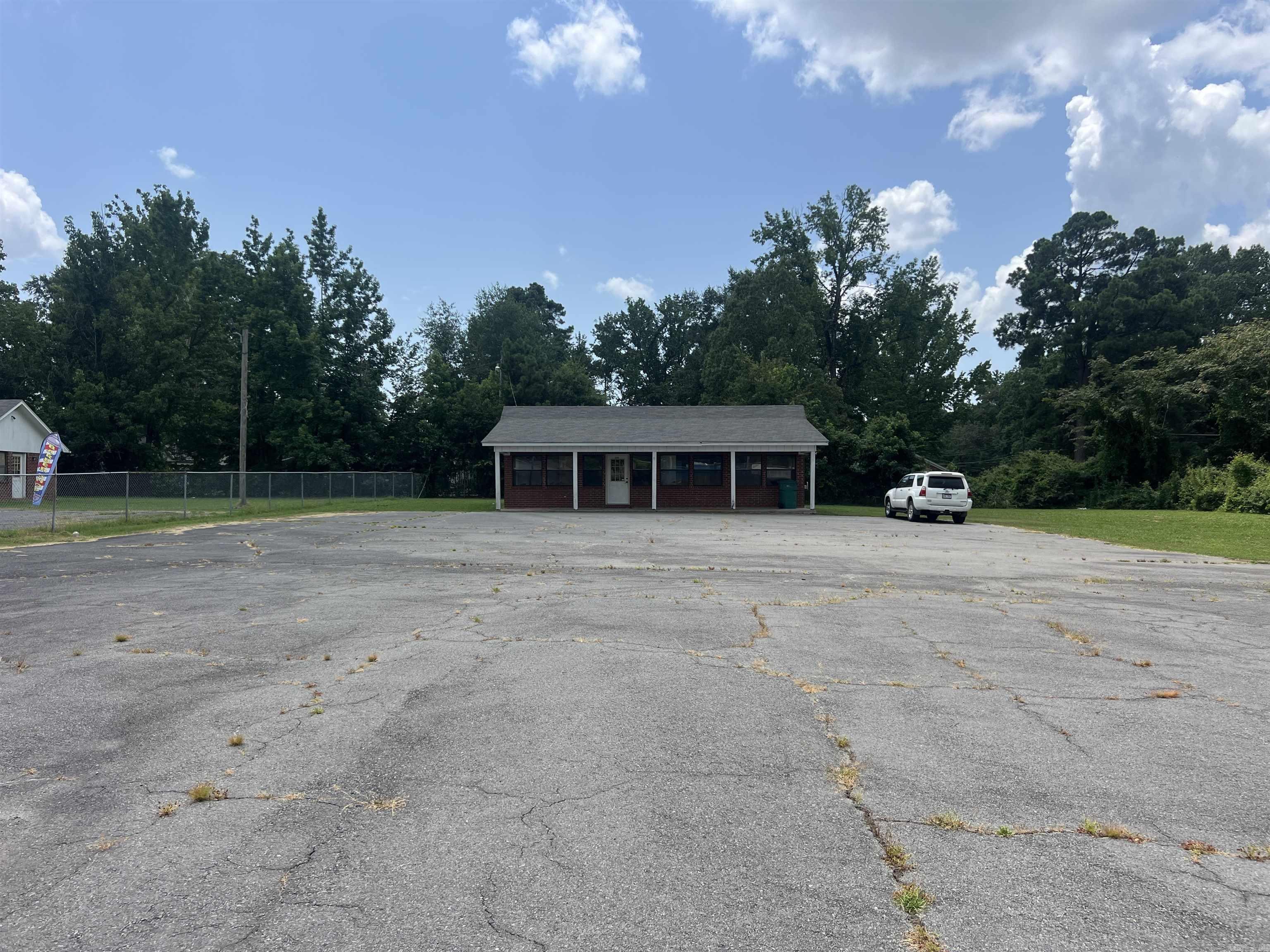 Great investment opportunity, this former used car lot is located in a high traffic location and would be great for another car lot, a real estate or tax office or a hair salon plus many other choices.  If you are looking for a high traffic, high visibility location in between White Hall and Pine Bluff, this is the perfect location!