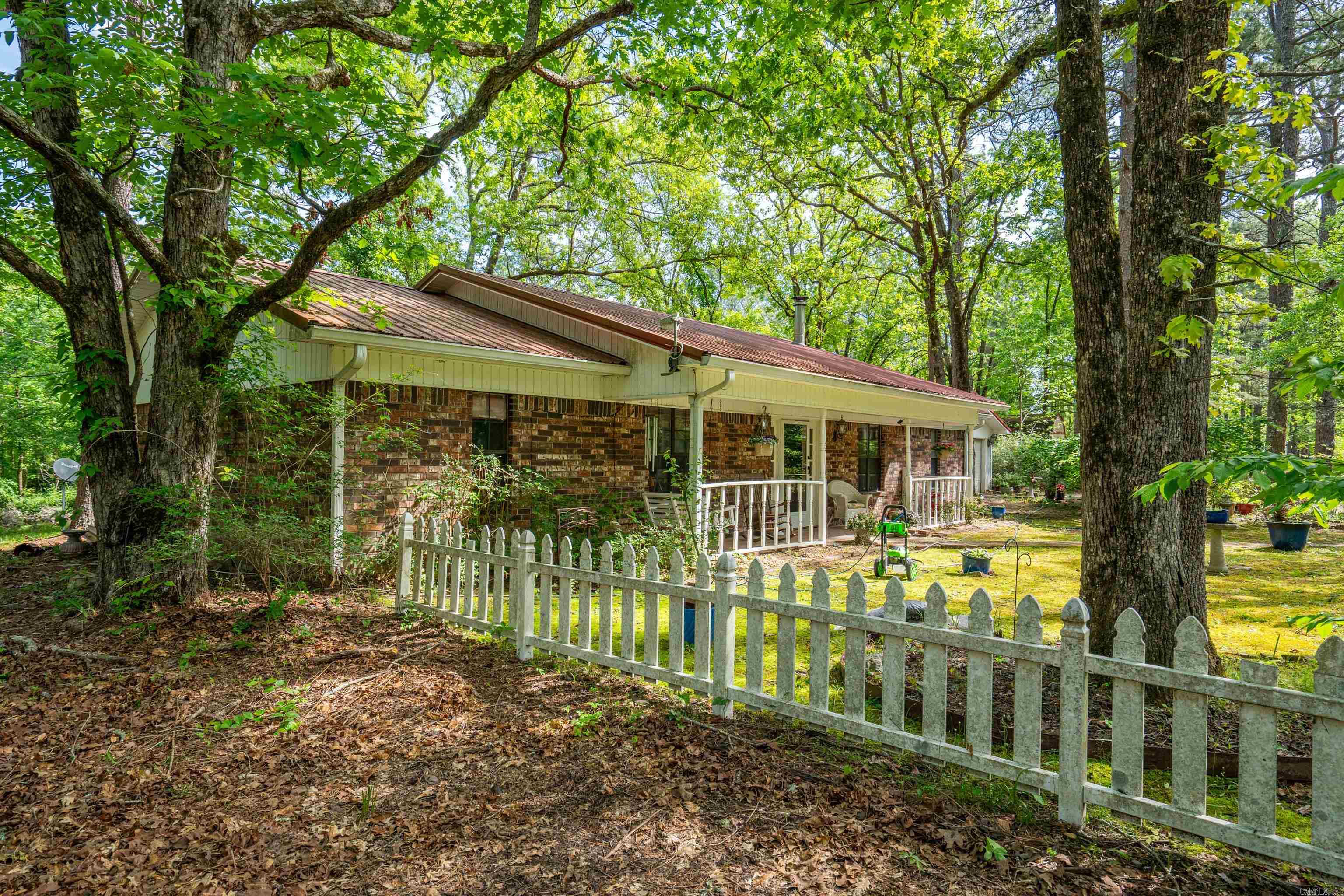 This wonderful property is priced to sell. Enjoy the peaceful wooded 32.45 acres that is just a hike from the Little Mazzarn river. With a little care this home can be turned into a rustic retreat boasting a double wood patio excellent for entertaining, cookouts or just enjoying the serenity of the woods! Semi secluded in your own country retreat. Abundant wildlife and nature abound here. This home has a cozy living room with fireplace as well as an additional large family room with wood burning stove. Plenty of place for storage as well as RV parking. This is an Amazing and Rare opportunity to purchase a home in this location! You have to see it to believe it! Come see it soon!