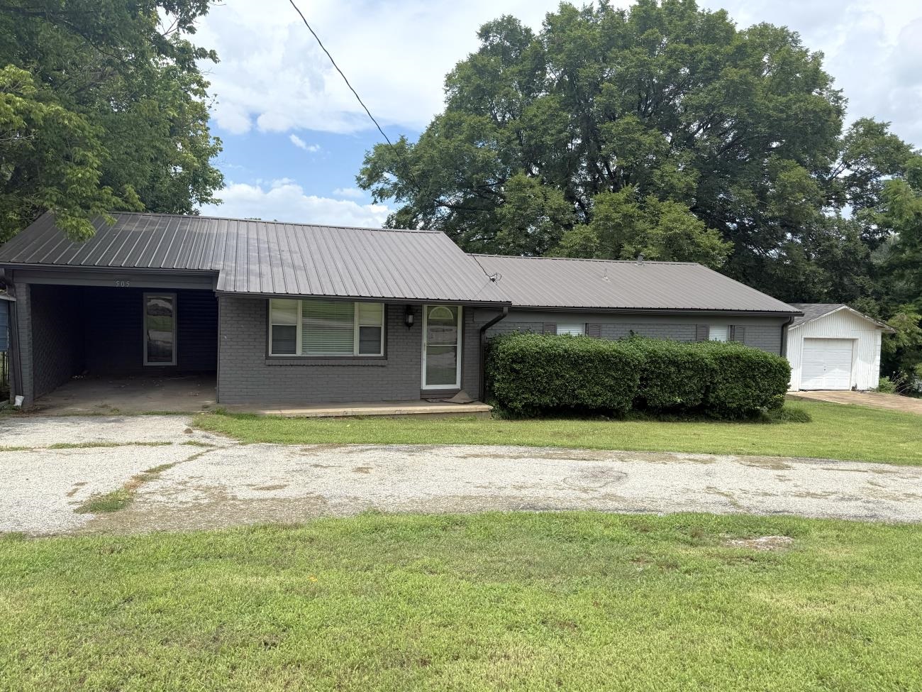 If you're needing a home with lot of bedrooms, for a reasonable price, you have found it! This home has 4 bedrooms, 2 full bathrooms, and room to grow.  The attached carport could easily be made into another bedroom, or a second living space, because there is also a portable carport, as well as a detached garage. The back yard is completely fenced, with a nice deck right out of the back door where you can sit and watch your children on the playground equipment! The detached garage has room enough for a car, boat, or you could just use it as a workshop.  There a lots of upgrades to the home on the inside and outside, so don't let this one get away!