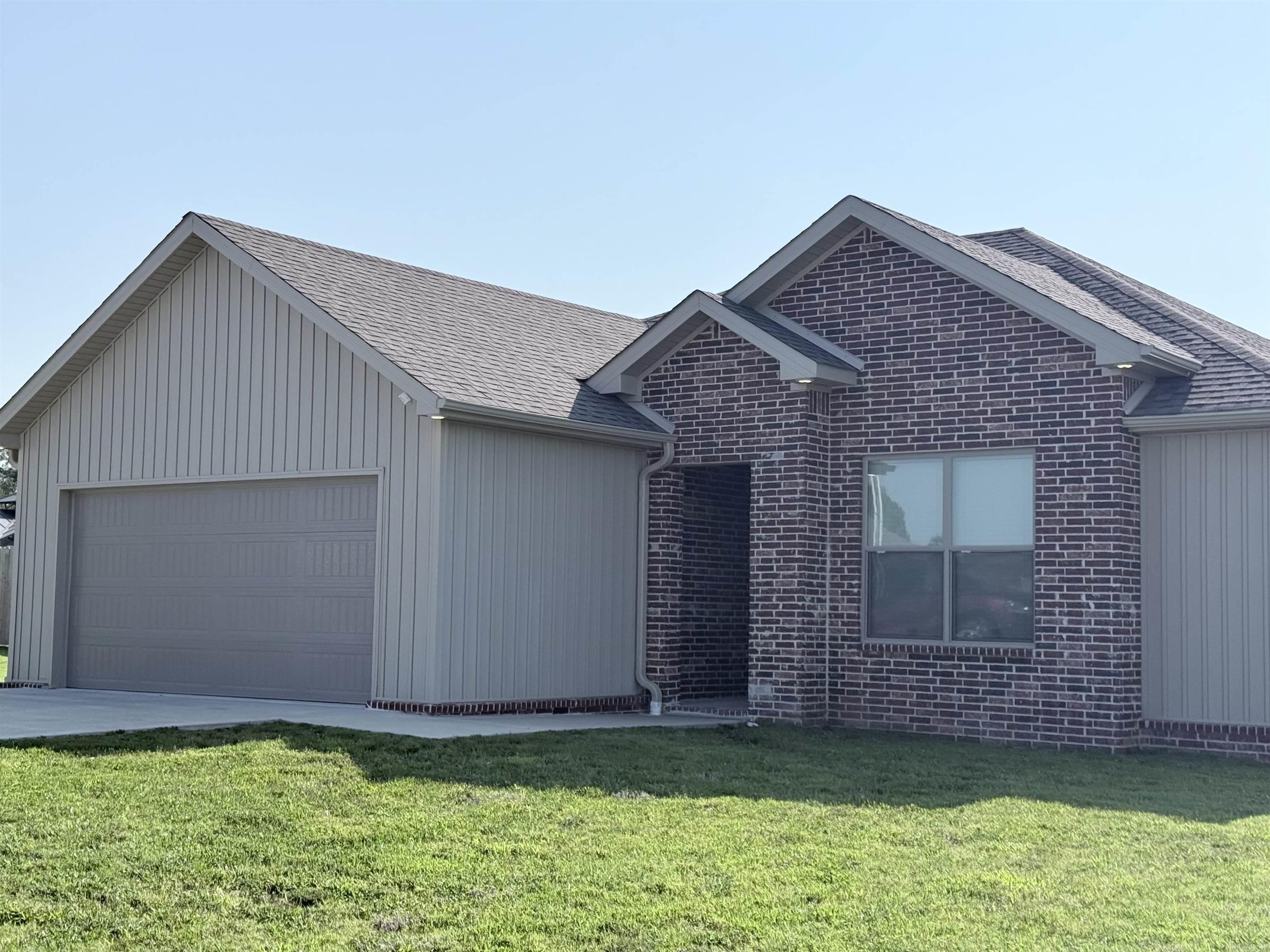 Built in 2024, this beautiful all-electric home offers modern style, low-maintenance living, and a desirable location in the Oak Grove area. Situated on a 0.25-acre lot, this 3-bedroom, 2-bath home features an open-concept floor plan designed for comfortable everyday living and easy entertaining. The spacious living area is highlighted by an electric fireplace, creating a warm and inviting focal point. The kitchen features crisp white cabinetry, ample workspace, and a neutral color palette that complements any dcor. Throughout the home, you'll find modern finishes and timeless colors that make it move-in ready. Step outside to enjoy the covered back porch, perfect for relaxing, grilling, or gathering with family and friends. Constructed with a combination of brick and vinyl siding, this home offers lasting curb appeal with minimal upkeep. Conveniently located in Oak Grove, you'll enjoy quick access to schools, shopping, dining, and everyday conveniences. Don't miss the opportunity to own this like-new home in a growing and convenient neighborhood!