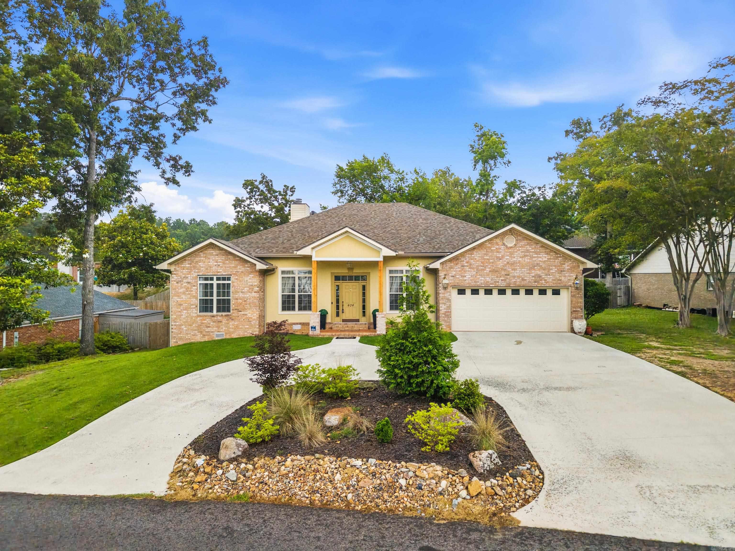 Located on highly coveted Peninsula Drive, this well-kept 4-bedroom, 3-bath home offers an exceptional combination of space, functionality, and outdoor living with beautiful lake views. Designed with a split floor plan, the home features generously sized rooms that provide both comfort and privacy, ideal for everyday living and hosting guests. The interior is warm and inviting, highlighted by a gas fireplace that anchors the main living space. Abundant storage throughout the home ensures everything has its place, adding to the home’s practical appeal. Outdoor living truly sets this property apart. Enjoy tons of entertaining space, including a large deck and a coveted patio, perfect for gatherings, relaxing evenings, or taking in the scenic surroundings. The circular driveway enhances both curb appeal and convenience, offering ample parking for residents and guests alike. Recent updates include a new roof, providing peace of mind for the next owner. With its prime location, thoughtful layout, expansive outdoor areas, and meticulous care, this Peninsula Drive home is a rare opportunity to own in one of the area’s most desirable settings.