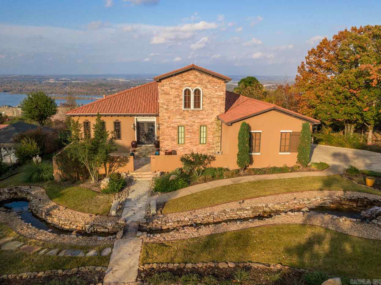 Magnificent Italian villa with stunning RIVER VIEW ! Meticulously Custom built in 2009, everything about this home is like brand-new, inside and out.  Main level has formal dining, library, wet bar, "great" great room, fabulous cook's kitchen, all with a view of the Arkansas River. Wonderful master suite w/awesome view.  Lower level has 2 very large bedroom suites, safe room. Parking for 5 cars.  Not included in living area SF :  lower level garage and Safe/Tornado.  Both are heated/cooled. Rare opportunity