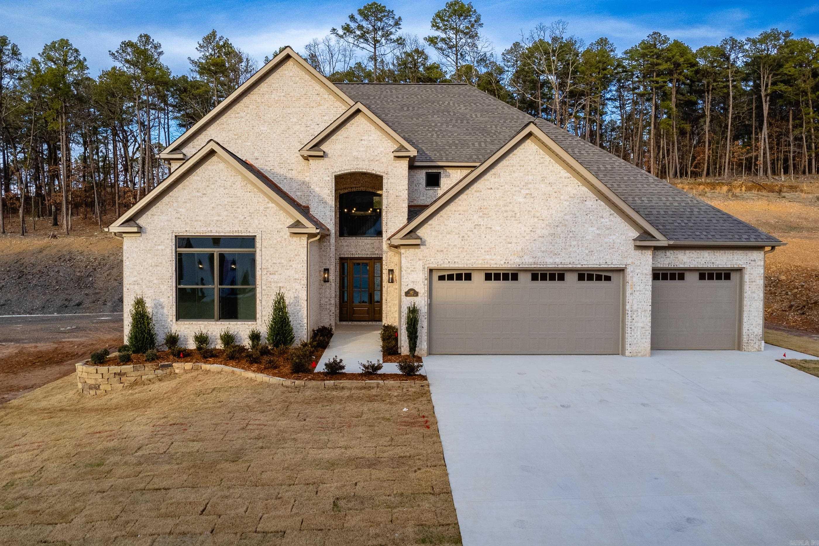 142 Abington Circle in Chenal Valley is a truly custom-built residence, offering exceptional craftsmanship and luxury throughout. The home features soaring ceilings and a thoughtfully designed open-concept floor plan, complemented by a prep kitchen and gourmet-grade appliances. With five bedrooms and four-and-a-half baths, the layout delivers both comfort and functionality. Highlights include an oversized walk-in shower and an elevated, luxury finish-out at every turn. The property will include a fully fenced backyard, indoor and outdoor fireplaces ideal for year-round entertaining, and an oversized three-car garage.