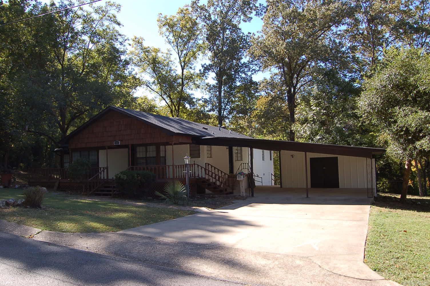 Great home with 3 bedrooms & 2 baths. Decorative wood burning stove in the large living area that is open to kitchen & dining. An additional room behind the living area would make 4th bedroom, office, playroom, etc. Nice covered back porch great for entertainment. Spacious storage room off the carport. Original wood flooring that has been restored. The lease for this property is for 2 years with a 3% increase after the first year. Income has to be 3x the amount of rent. NO SECTION 8.