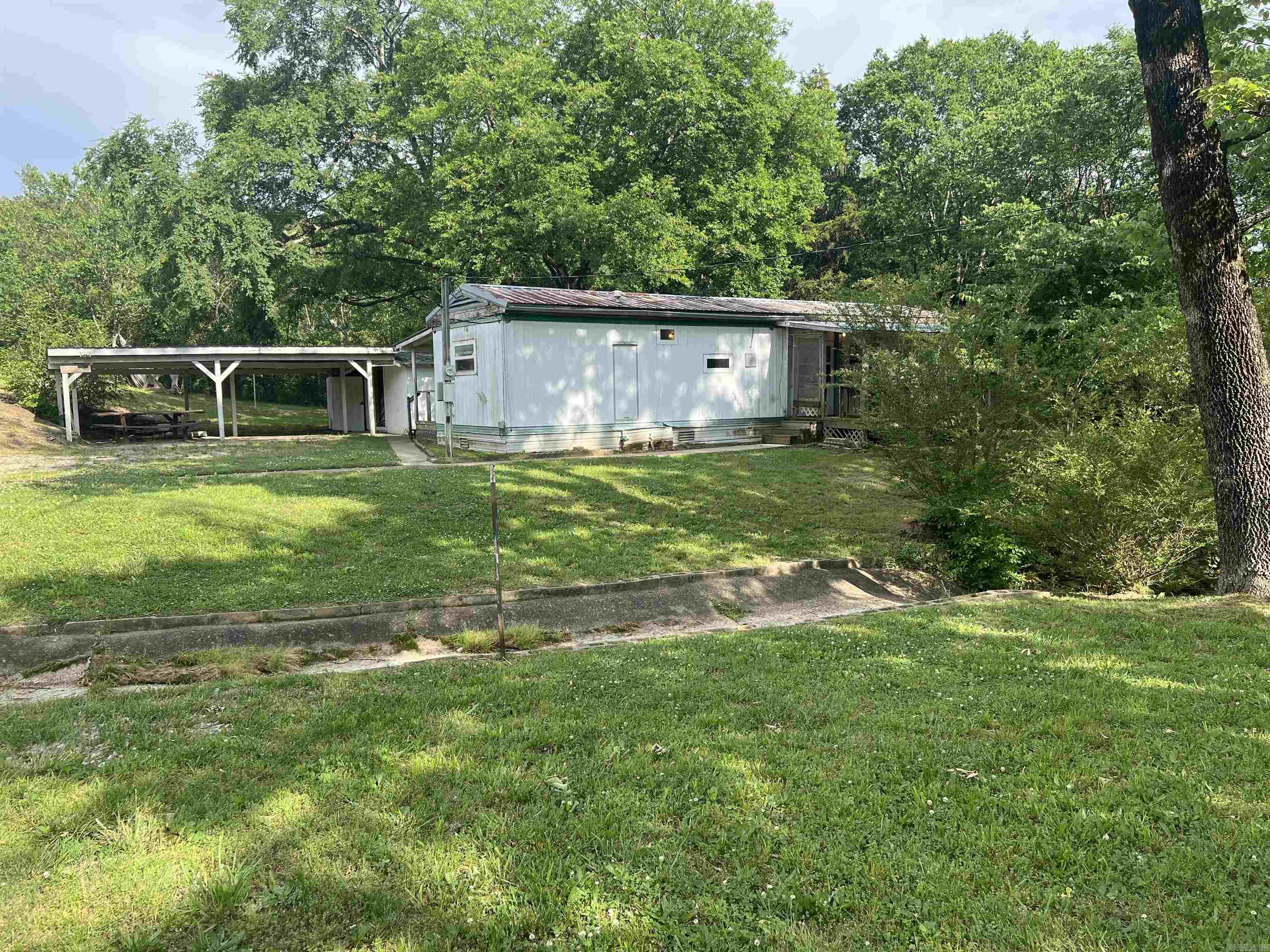 Investors, don't miss this opportunity! 2 bed 1 bath mobile home situated on two lots with plenty of potential for rental income. Great investment property with room to grow.! It is a fixer-up property.