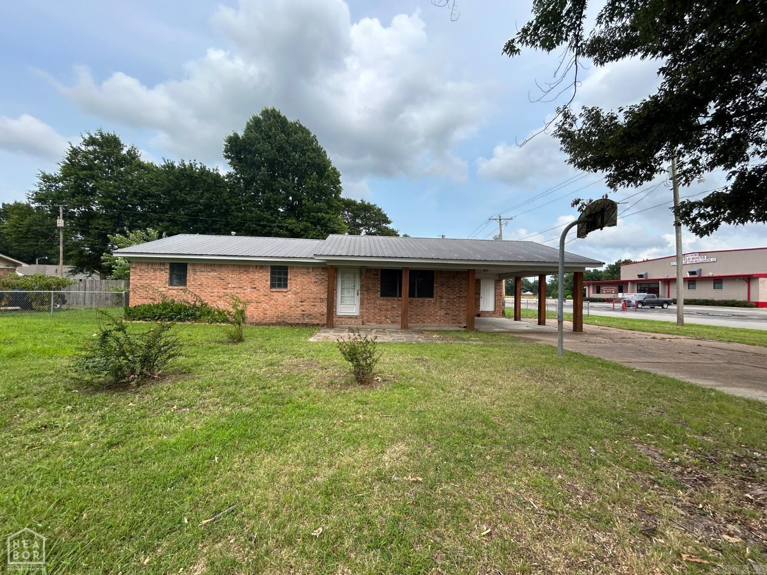 This remodeled 3 bedroom 2 bathroom home is ready for new owners! New flooring has been placed in all areas of the home; laminate in the kitchen/living room/laundry room and new carpet in all of the bedrooms! Both bathrooms have been updated with tile flooring, new vanities, and light fixtures. In the kitchen you will find granite countertops and beautiful backsplash. The home sits on a shaded lot with a fenced in back yard and is right across from the school! Don't miss out on this one!