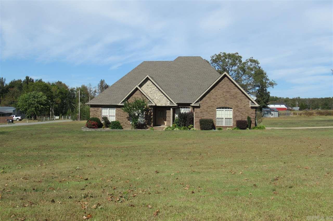 4 bedroom 2.5 bath home with office, nice eat-in kitchen with surface range and wall oven, formal living/dining room, hardwood floors, tray ceilings and crown molding.  Master bedroom has large walk-in closets, jetted tub, stand-up shower and double vanities, double vanities in hall bath. Nice covered patio with extended deck and Tiki bar. Great location sitting on 1.43 acres.