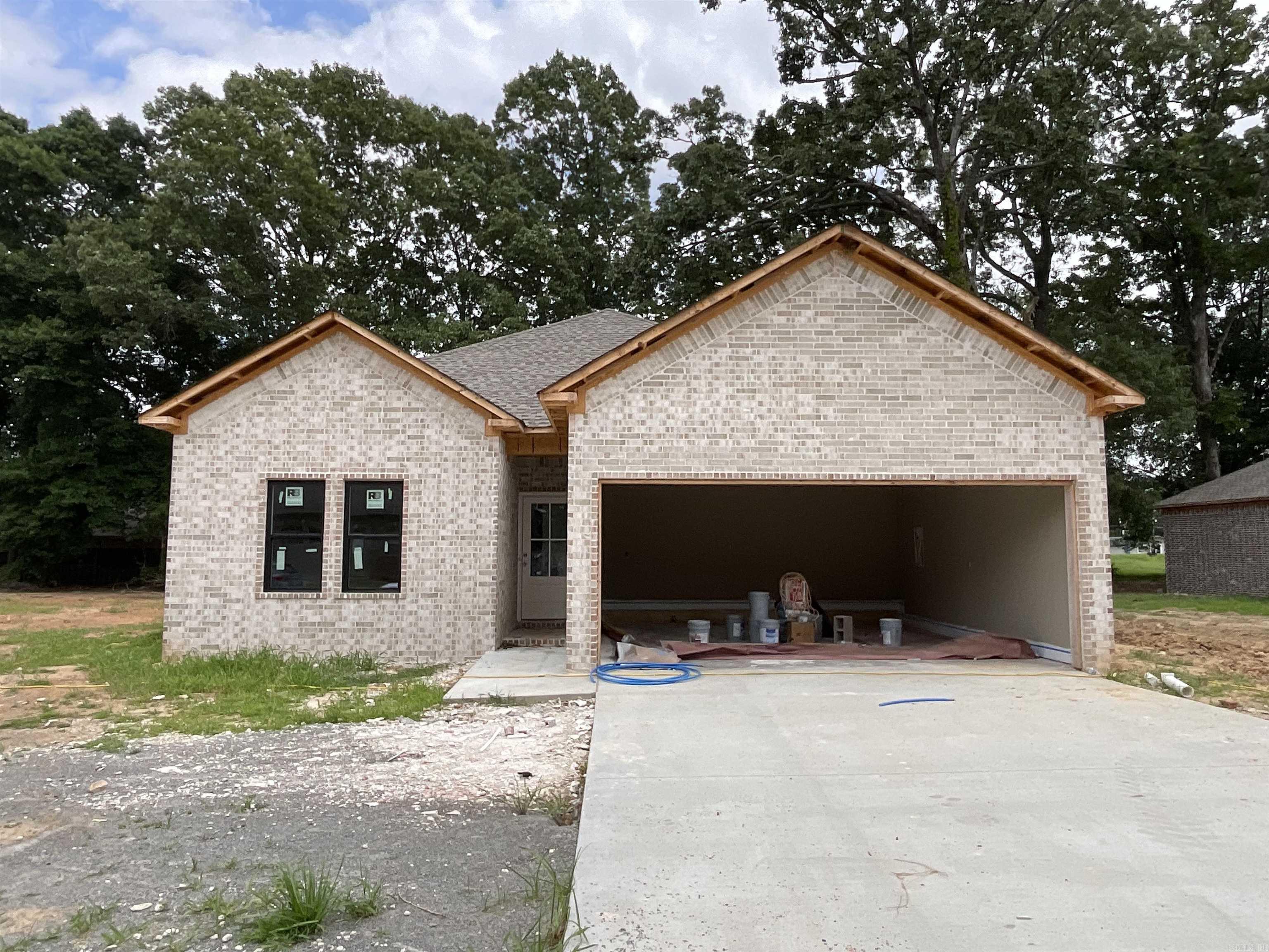 Lonoke is getting some wonderful new additions to this beautiful neighborhood! Super convenient access to I-40 makes this a tucked-away gem! All-brick exterior opens to a spacious cathedral ceiling in the living room and an even larger kitchen/dining space! You will find all these rooms "just right" in size, including the primary bedroom with a huge closet! Paint started and flooring under drop cloth is gorgeous!