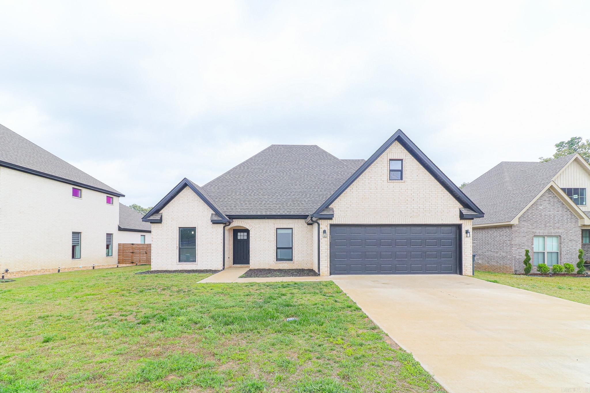 This stunning 4-bedroom, 2.5-bath brick home in the highly sought-after Hilltop area of Jonesboro offers the perfect blend of modern amenities and prime location near ASU and NEA Baptist Hospital. The home features a bright, open floor plan with a great kitchen featuring granite countertops, stainless steel appliances, a breakfast bar, and a dedicated breakfast table area, alongside a separate formal dining room. The family room is anchored by a cozy fireplace.  The spacious primary suite offers a luxurious tiled shower and a walk-in closet.  The privacy fenced backyard includes a covered porch for year-round entertaining. Call or text today for more information or to schedule you showing appointment!