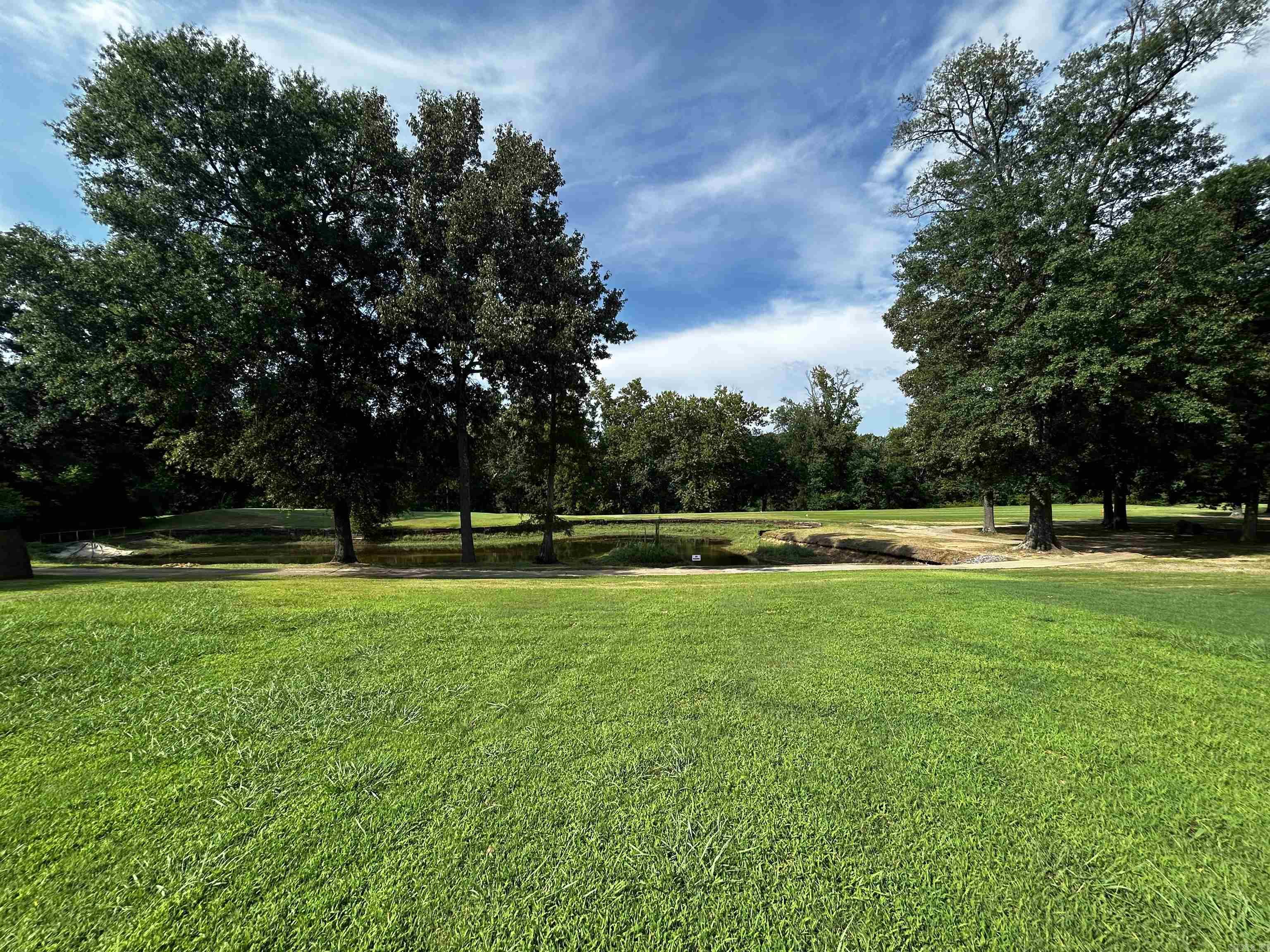 Rare opportunity on this spacious .28 acre +/- lot on The Course at River Oaks. This lot has a beautiful view, overlooking the 14th fairway and green. The Little Red River is also just steps away, on the other side of the fairway.