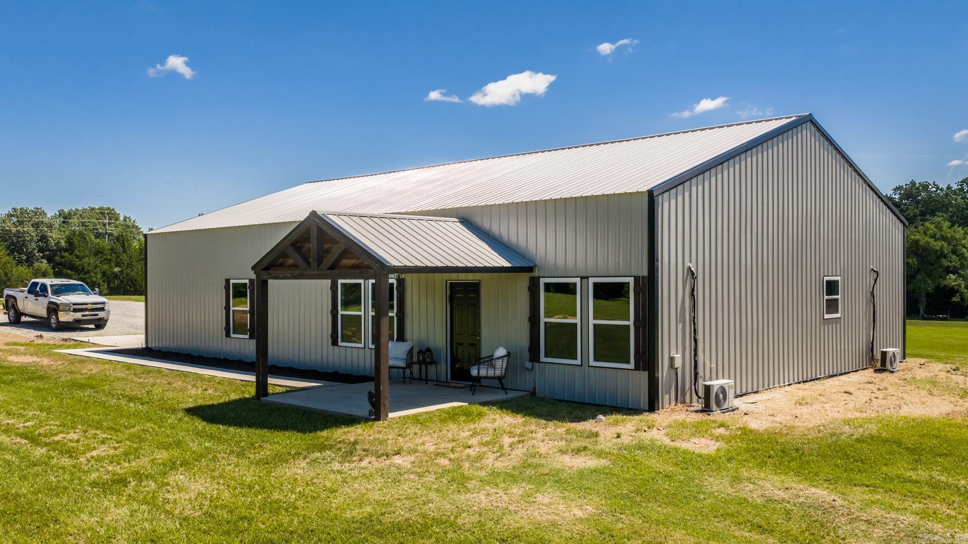 MODERN BARNDOMINIUM LIVING ON 3 Acres!?  Looking for the perfect blend of country living and modern convenience? This stunning 2400 square foot barndominium offers approximately 1,200 square feet of heated and cooled living space plus an additional attached 1,200-square-foot shop/garage also heated and cooled, giving you room for hobbies, storage, business equipment, or all your toys. Situated on 3 beautiful acres, this property features a spacious yard, peaceful surroundings, and great neighbors while still offering easy access to town. Inside, you’ll find stylish finishes, an open-concept layout, and comfortable living spaces designed for everyday life. Whether you’re searching for a home with workshop space, room to roam, or the ultimate setup for work and play, this property checks all the boxes. Bring your RV, boat, side-by-side, or dream hobby because there’s room for it all! WELCOME HOME!!!!