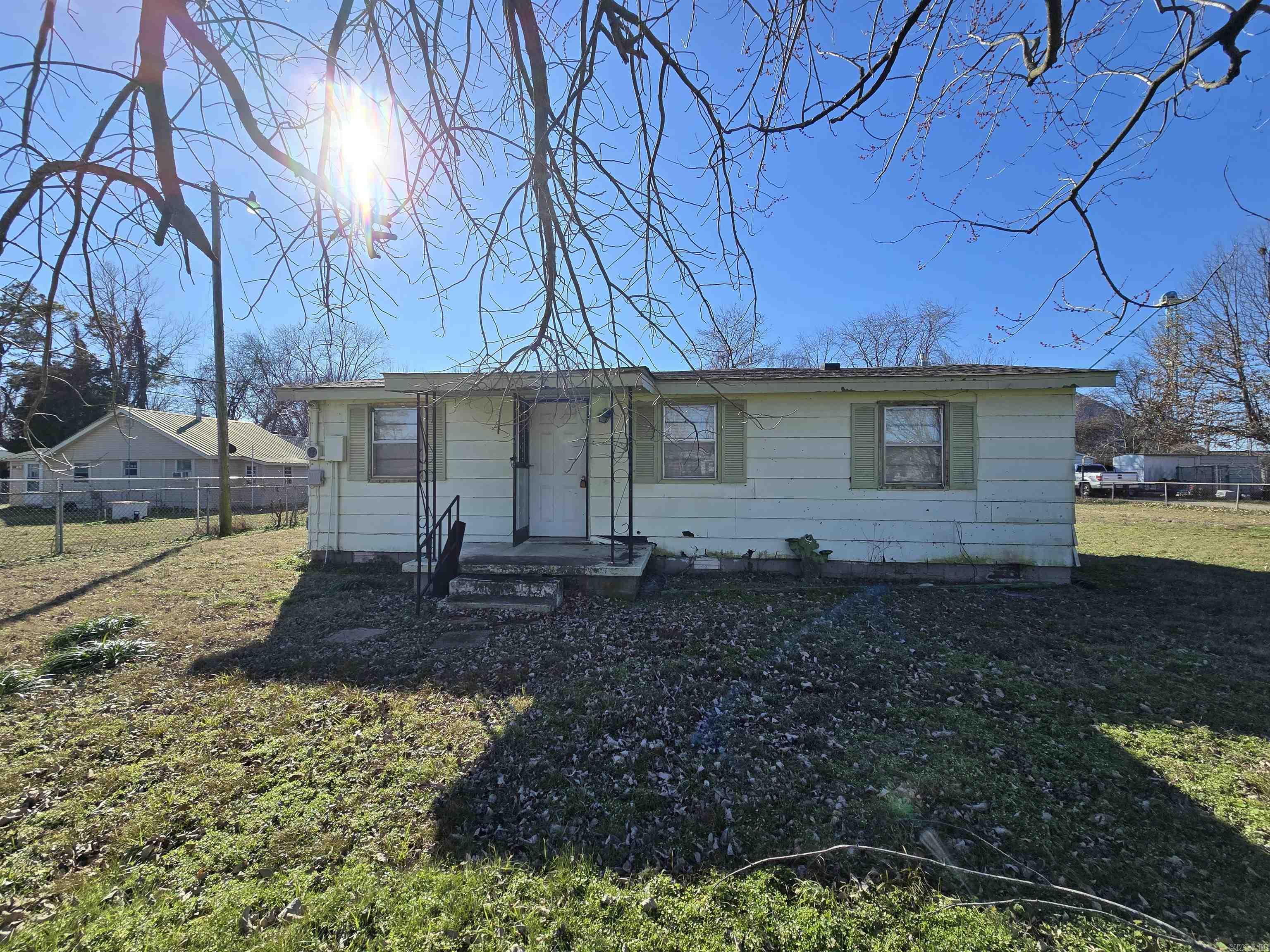 Welcome to the market this super cute appx 828 sq ft, 3 bed/1 bath home just outside of Jonesboro and very close to the Trumann County Club in Trumann, Arkansas! Sitting on an almost half Acre lot, this appx 1972 built home is waiting for a beautiful restoration! On a paved road with all the city utilities already in place, this cute home could be used for a starter home for a small family or an investment as it would be ideal for a rental. At just 2 miles from the I-555 interstate, you could be in Jonesboro, AR in about 10 minutes or Memphis, TN in around 45 minutes making work commute to the closest major cities a breeze. This area is a well established community with neighbors remaining in the area for decades and bringing their own adult children to raise their families there too! Also on the spacious property is a storm cellar, a cinder block shed and another metal shed making storage possible. *This home is agent owned and being sold AS IS and is priced UNDER bank appraisal!