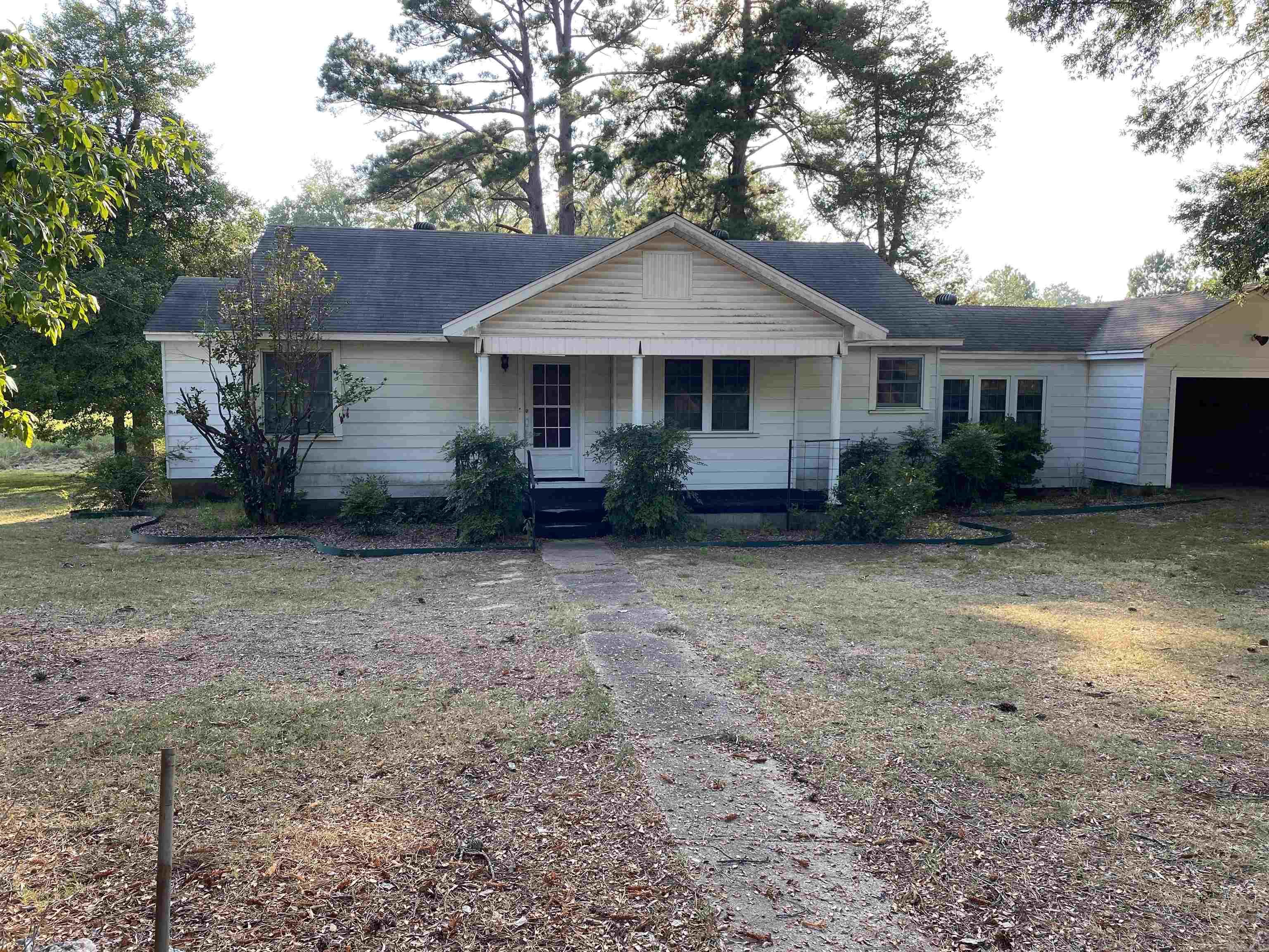 Come see this diamond in the heart of Haskell. This property is zoned Commercial and consists of 2.01 acres, 2 large storage buildings/shops, tornado shelter, and mature trees. The house is solid and has been well cared for. But, it is ready for you to make it your own. 3 bedrooms and 1 bath with a walk-in tub. Spacious living room just off the large eat in kitchen. 2 additional rooms off the kitchen gives you more options and tons of space. This could be a great 1st time home or an investors dream! Agents see remarks.