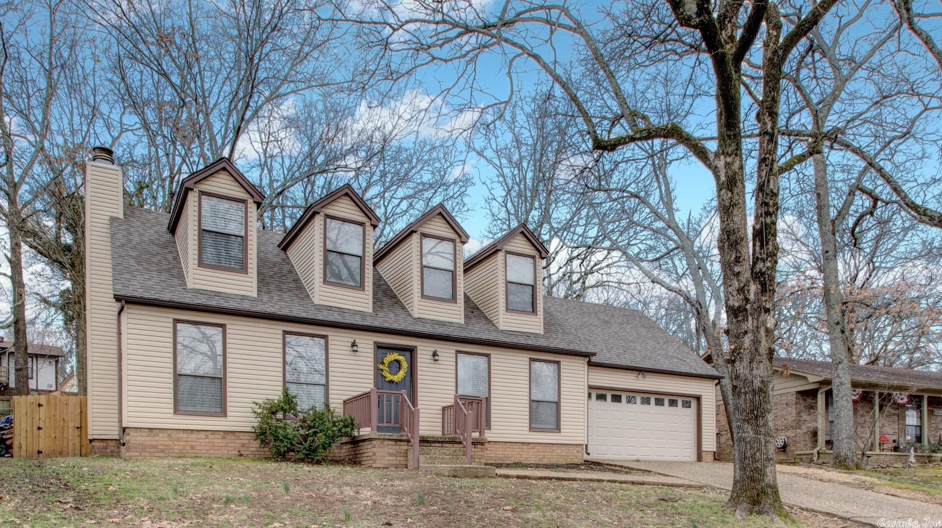 Beautifully updated home in NLR in a wonderful, convenient location!  Updated finishes include luxury vinyl flooring, updated kitchen and baths, lighting, and carpet! New, fully fenced back yard this last year as well.  Roof is only 2.5 years old. You will love the spacious living area with wood burning fireplace.  Primary suite is downstairs.  Upstairs hosts two spacious spare bedrooms with great closet spaces and J&J bath with dual vanities and separate bath area.  Fabulous walk-out storage area upstairs also.  You will love the screened patio area out back that overlooks large backyard.