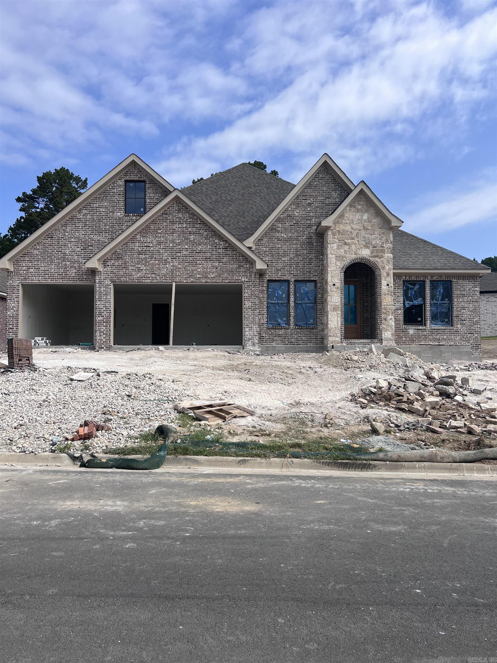 New Construction Home in Red Oak Ridge.  Carriage Custom Homes will complete this home late summer of 2026.  Offering 3 Bedrooms, two and one half baths, and a  study .  Beautiful finishes that you expect in a Carriage Home.  Large kitchen Island anchors the kitchen space that opens into the living room with a gas log fireplace. 12 ft. ceilings.  The primary suite offers spacious custom closet and beautifully appointed primary bath.  Neighborhood amenities include, gated entrance, walking paths, hiking tails, community pool, two private lakes for fishing and recreation. Square feet is approximate, please feel free to measure. Tax information is available from Garland County Tax Accessor.