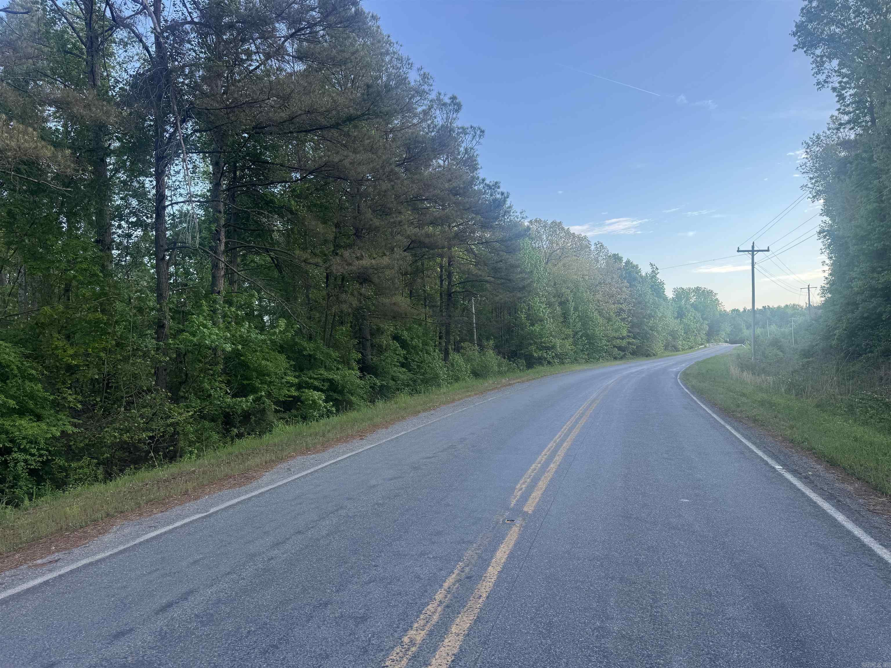 Opportunities like this don’t come around often - a buildable tract overlooking the legendary Bayou Bartholomew, offering the perfect mix of lifestyle, recreation, and long-term potential. Whether you're looking to build your dream home, establish a hunting camp, or invest in a versatile piece of ground, this property checks all the boxes. With utilities nearby, this is a true blank slate ready for your vision. Picture a cabin tucked just off the bayou where you can enjoy quiet mornings with coffee, watching the water move through the timber, or evenings listening to the woods come alive. The setting offers privacy while still being within reach of nearby towns and everyday conveniences. From a hunting standpoint, this tract punches above its weight. The layout naturally creates a funnel for wildlife movement, making it an ideal setup for deer hunters. The surrounding habitat supports strong wildlife activity, and the proximity to the bayou provides a consistent water source that attracts game year-round. This is the kind of place where slipping in for an afternoon hunt can turn into a memory that lasts a lifetime. The mix of habitat, location, and buildability makes this a rare fi