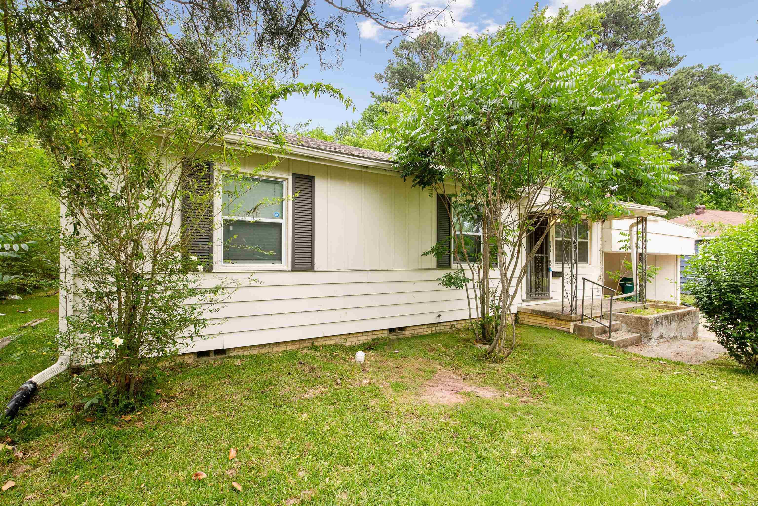 Welcome to 166 Tulane in Benton! This charming 3 bedroom, 1 bath home offers comfort, convenience, and plenty of potential. Tucked away with peaceful green space behind the property, you’ll love the private backyard setting perfect for relaxing, entertaining, or enjoying quiet evenings outdoors.  Inside, you’ll find a functional layout with great storage throughout, plus a workshop/storage room under the carport that’s ideal for hobbies, tools, or extra space. The storm cellar adds peace of mind, and the location can’t be beat — just minutes from everything Downtown Benton has to offer including shopping, dining, schools, and entertainment.  Whether you’re searching for the perfect first home or looking to add a solid investment property to your portfolio, this one is full of opportunity! Make an appointment to view today!