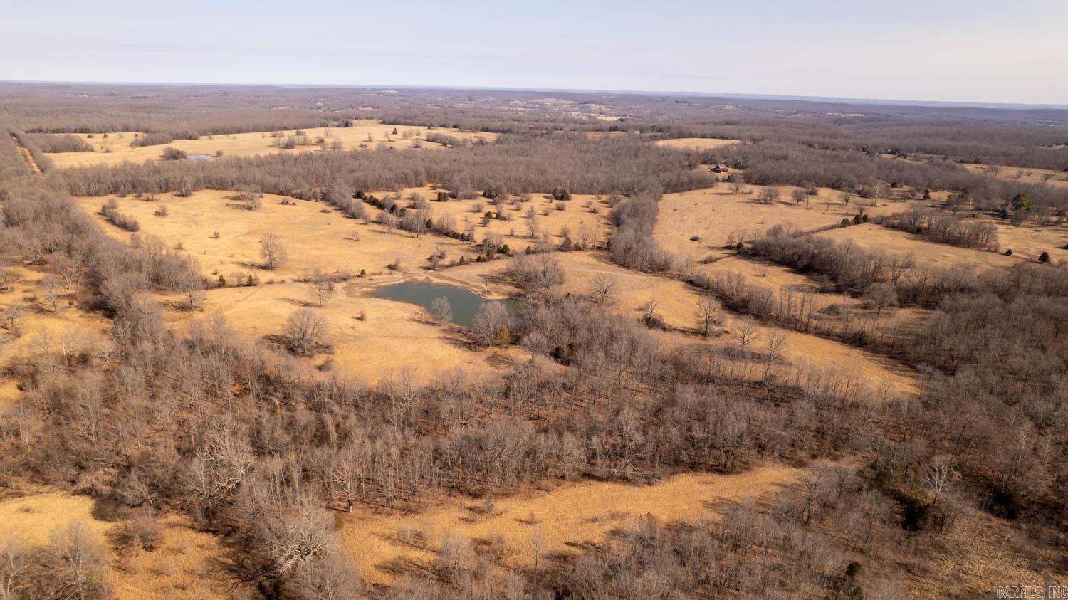 479 ± Acres on Pleasant Run Road | Northern Arkansas Farm & Hunting Land  This 479± acre tract in rural Northern Arkansas offers a rare opportunity to own a large, versatile farm with approximately 220 open acres and 259 wooded acres. The open ground is suitable for pasture, with some areas capable of hay production. Improvements include an old barn in decent condition and a cattle working pen with head catch. The property is perimeter fenced in fair condition and features more than 10 ponds that provide water for livestock and wildlife. Electric is accessible to most areas of the farm, and the land lays well with multiple potential building sites. Excellent hunting opportunities, low property taxes, available with less acreage.  OWNER/AGENT  TAXES TO BE ESTABLISHED UPON CLOSING.