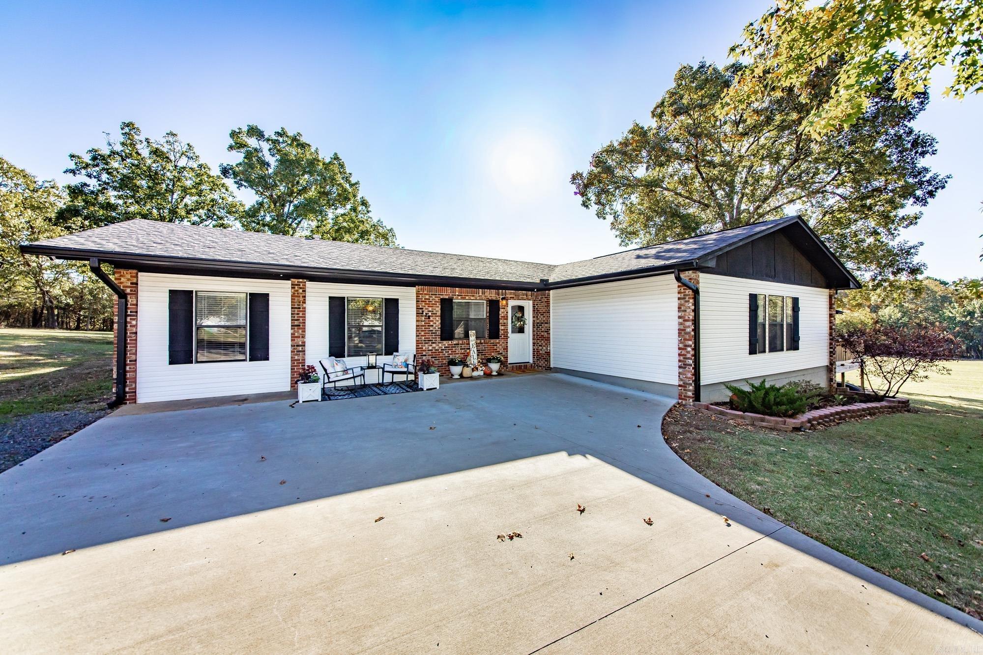 Welcome home to peace and plenty of space! This inviting 4-bedroom, 2-bath home sits on 3.65 beautiful acres at the end of a quiet dead-end road. Remodeled in 2016, it offers an open floor plan with a large family room perfect for gathering & making memories. The spacious primary suite includes a cozy gas fireplace, walk-in shower, & his-and-her walk-in closets—an ideal retreat at the end of the day. Step outside to a huge yard made for kids, pets, gardening & outdoor fun, or relax on the large deck that’s perfect for grilling, entertaining, or simply enjoying the peaceful surroundings. There is a 12x16 shop/storage building with electricity perfect for hobbies. Located just 6 miles from Choctaw Campground/Marina on stunning Greers Ferry Lake & half a mile to Walmart and Ozark Health hospital, this home brings together quiet country living, close proximity to city amenities & easy access to the water.