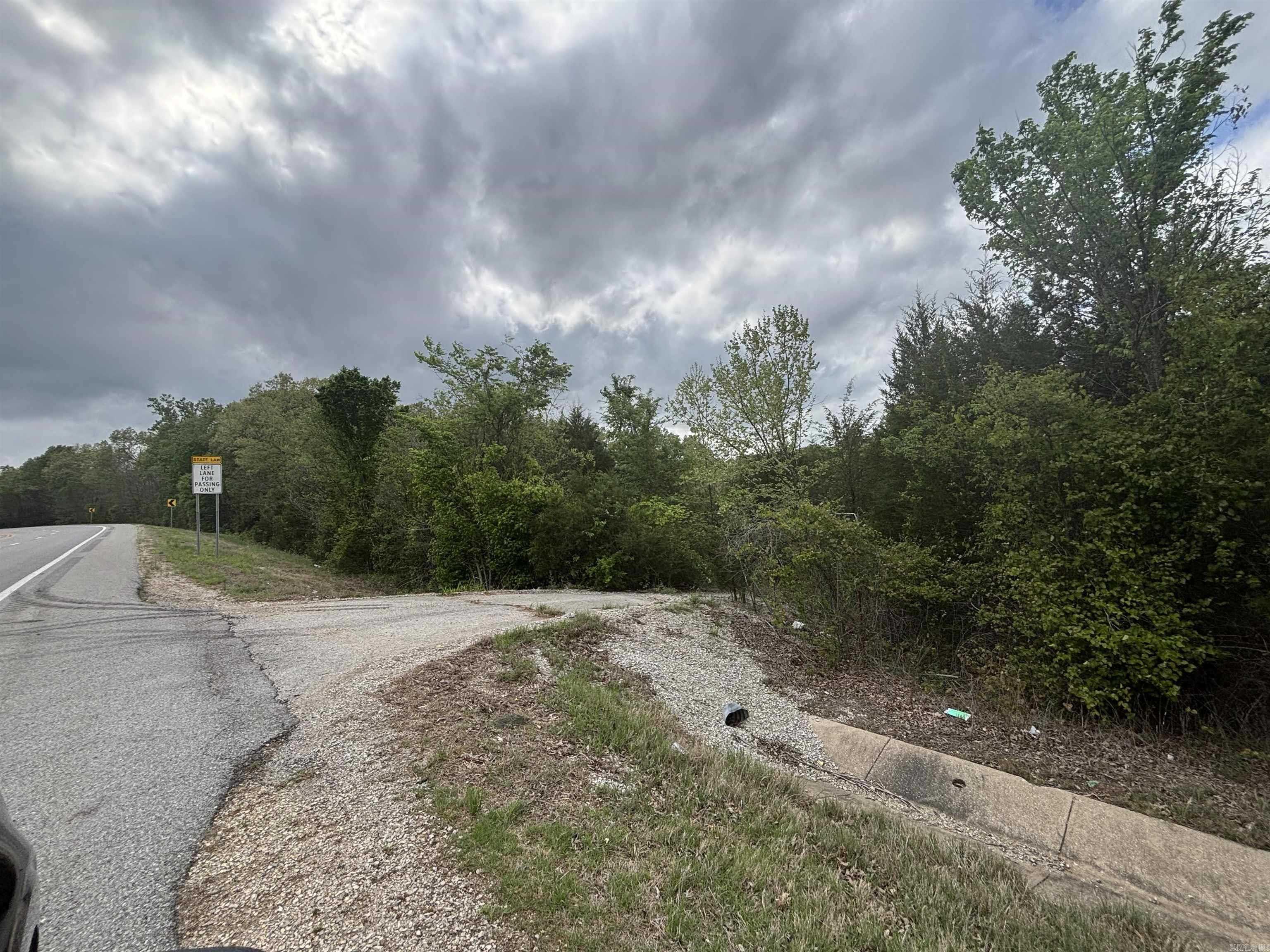 5 lots on Little Creek Circle. Back side of property reaches Hwy 167. Mostly wooded with a small creek. Property can be used for commercial or residential use. Utilities available at the road.