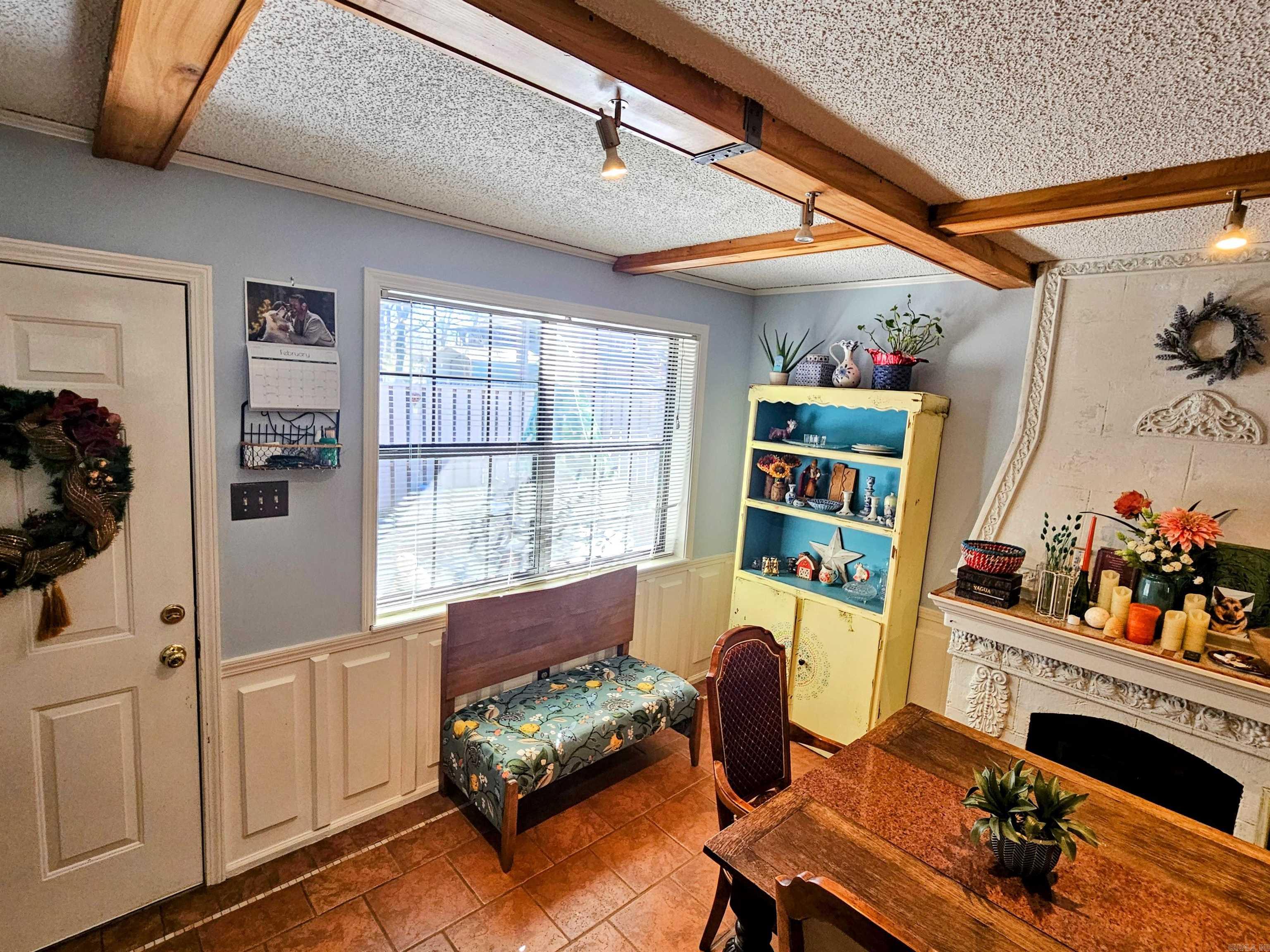 No upstairs or downstairs neighbors! Two unique electric heating fireplaces bring a charming European feel to this condo, located in a quiet, peaceful neighborhood. Very secure and safe. Part of a 30-unit complex which backs up to a greenbelt, it is near Central Avenue shopping, CHI St. Vincent Hospital, restaurants, Oaklawn Racing and Casino, and has easy access to the Hot Springs Creek Greenway Trail. Enjoy a welcoming, fenced-in patio courtyard and a back deck with a nice view. Schedule your showing today! 2 beds, 2 baths, 1,350 sqft. New roof, eat-in kitchen with pantry cabinets, electric cooktop. Large, open dining and living area. Electric fireplace in kitchen and living room. Storage closet tucked into the courtyard patio area. Friendly neighbors, all 55+. Washer, dryer, and refrigerator convey. Monthly HOA fee of $230 covers water / trash pickup / outer insurance / groundskeeping and leaf blowing. Pet friendly.