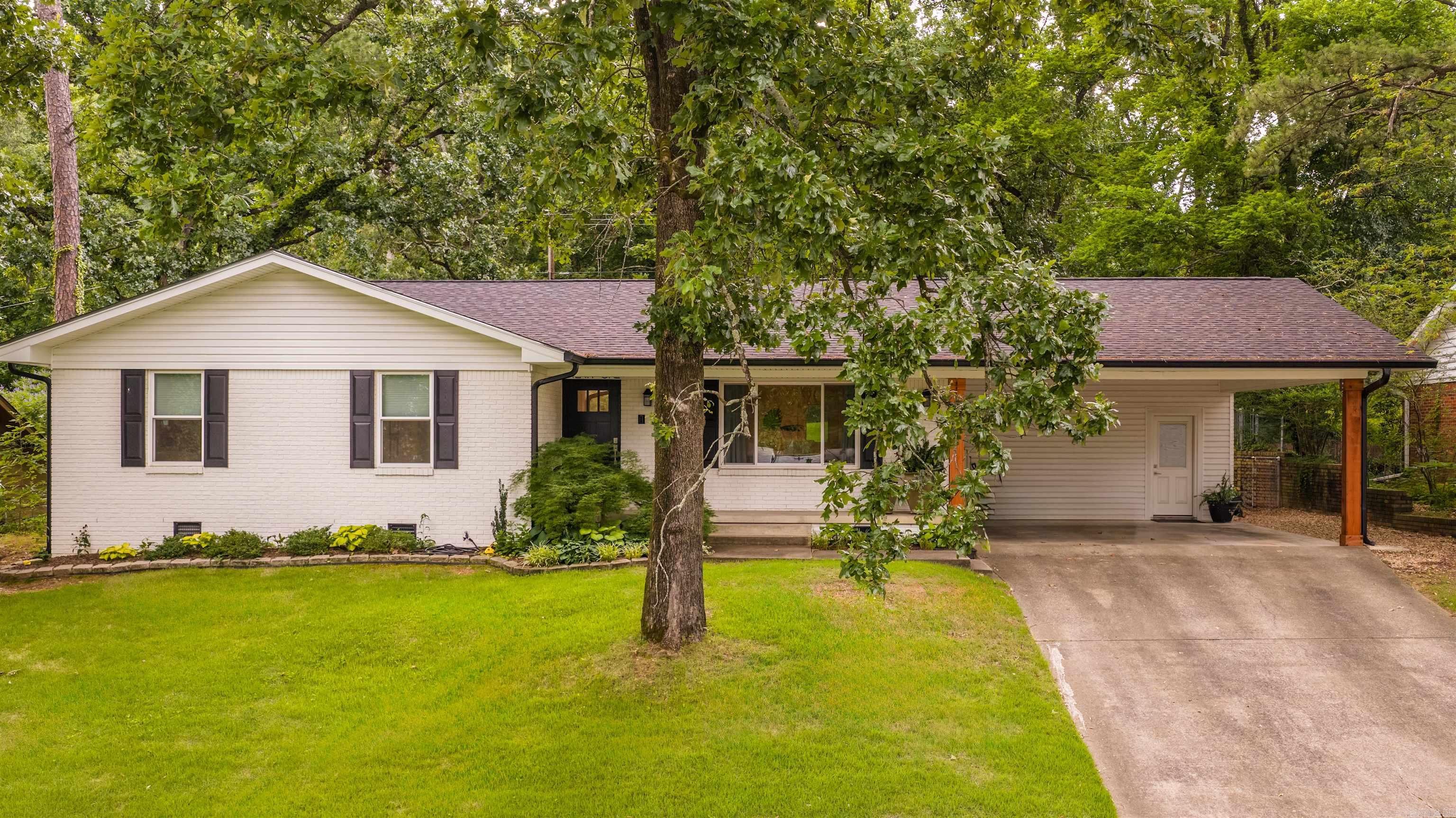 Beautifully remodeled one level home on one of Leawood's most desirable streets! This move-in-ready 3-bedroom, 2-bath home has been thoughtfully updated from top to bottom, including flooring, kitchen, bathrooms, windows, roof, and more. The inviting floor plan offers comfortable everyday living with a spacious living area centered around a cozy fireplace. You will love the well-planned kitchen with new appliances, granite countertops, and walk in pantry/laundry room. Outside, enjoy a fully fenced backyard, a two-car carport, and a welcoming neighborhood known for its friendly community pool, and convenience. A truly turnkey home ready for its next owners! Agents see remarks and docs for more information.