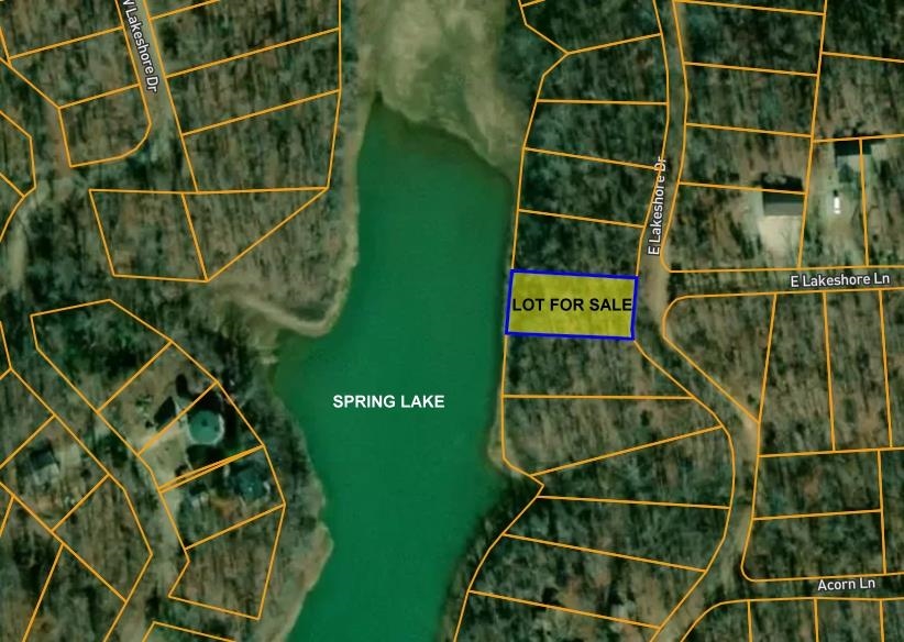 LAKEFRONT LOT ON SCENIC SPRING LAKE Build your dream home or weekend retreat on this beautiful wooded lakefront lot located directly on Spring Lake in Ozark Acres.  Nestled along East Lakeshore Drive, this lot is approximately 11,500 Sq. Ft.  The property offers privacy, natural beauty, and direct access to the water where you can enjoy fishing, swimming, kayaking or the serenity of Lake living.