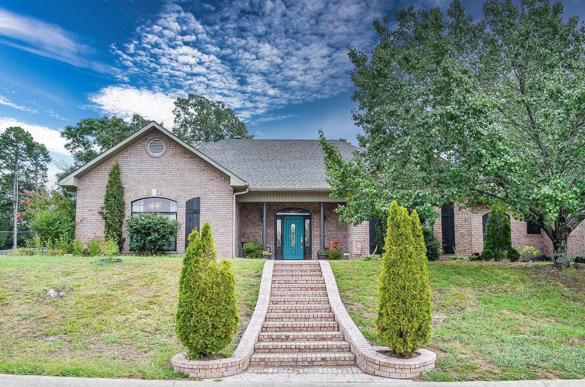 Beautiful 3 bedroom 3 bath home in Gated Ironwood Estates. All Brick Exterior. Fenced backyard. Kitchen has New Quartz counters 2025, with a center island and new cooktop 2021. Lots of cabinet storage. Large dining area off kitchen, Heated and cooled Sunroom. Living room has vaulted ceiling, hardwood floors and woodburning fireplace. Split bedrooms, Primary bedroom has tray ceiling. Bath has hardwood floors, jetted tub and walk-in shower, double vanity with New Quartz counters and New Fostoria sinks. Large walk-in closet. Laundry room with counter and shelving for storage. 2 New HVAC systems 2023. New Roof, gutter guards with leaf guards and Window screens 2023. 2 car Oversized garage, attic has floored area for extra storage. 2 Water heaters, one replaced around 2021. Lake Hamilton School district. This home has so much to offer! Tax records do not reflect heated & cooled sunroom. AGENTS SEE SHOWING REMARKS.