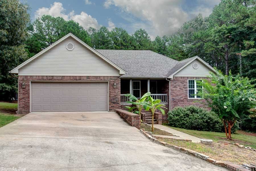 Surrounded by woods & Mtn Ranch course front & back, this open flow, split floor plan has 3 spacious bedrooms/2 full baths on main level & a fantastic split to the rear space ideal for 2nd living area, game room, shop or overflow sleeping accommodations w/ golf cart garage door & full bath! Adorable kitchen is wide open to DR/LR perfect for entertaining! Tons of counter/cab space & layout ideal for the family cook! Nature lovers deck!  Perfect for golfer, lake lover, weekender or retiree! Huge 2car Garage!