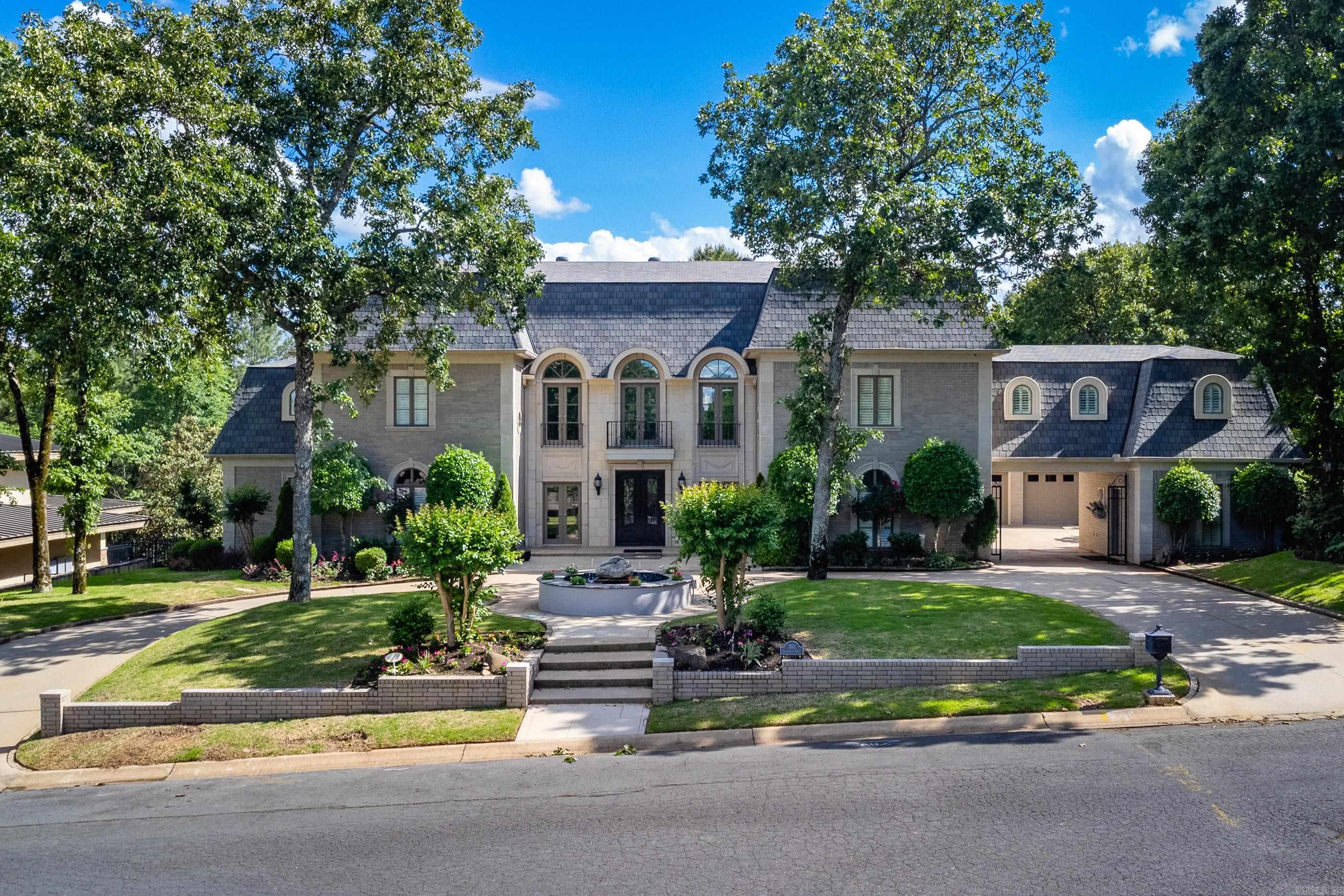 At $999,000, this custom-built Shady Valley estate offers secure resort-style living with privacy & scale at a compelling value. Backed by green space, the home is designed for effortless daily living while offering exceptional spaces for entertaining & retreat. The main living areas center around a beautifully remodeled kitchen w/ quartzite countertops, Sub-Zero fridge, double ovens, gas cooktop, ice machine, & generous pantry space. Multiple living & dining areas, along w/ a private office, allow the home to adapt easily to both work & relaxation. Outdoors, enjoy a true private oasis w/ an inground pool, hot tub, outdoor kitchen, & lush landscaping—ideal for unwinding or hosting. The upper level extends the lifestyle with a dedicated theater & game room, and the lower level showcases a fitness area overlooking the pool, creating a self-contained environment that replaces the need for external memberships. Other highlights include 5 bedrooms, 4 full & 2 half baths, a private office, whole-home generator, alarm & sprinkler systems, & garage parking for 3 vehicles. Updated and move-in ready, this exceptional home offers turnkey luxury with privacy and convenience. See agent remarks.