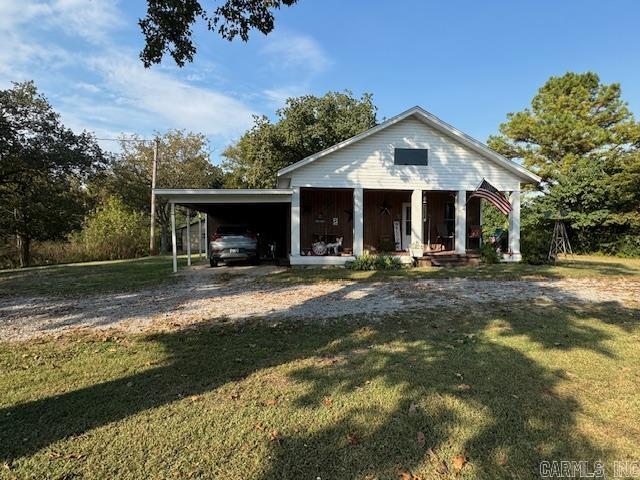 Rustic Charm in the Heart of Town! This 4 bedroom 2-bathroom house offers plenty of space and charm to go around. The main living areas boast solid wood panel walls and newer vinyl plank flooring. With 4 spacious bedrooms, this home has enough space for the whole family or guest. Situated on a large, level lot, this home has tons of outdoor space including a covered front porch and back wrap around deck with two covered spaces. Out back you will find a well-maintained, insulated shop with electric and a double drive-in door for mowers and lawn equipment