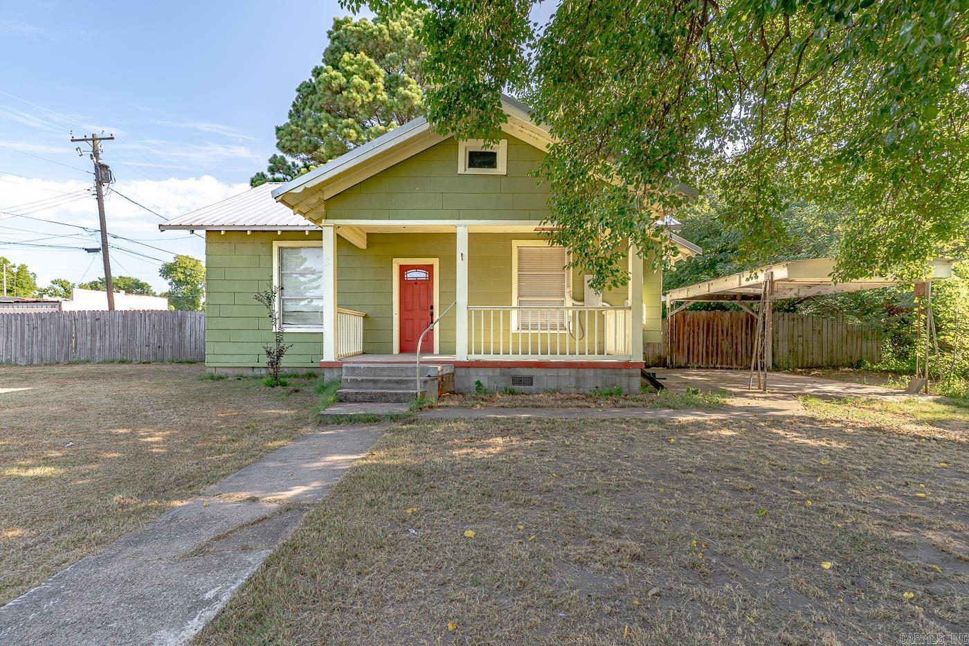 Welcome to 700 2nd Street in Lake City—You will enjoy this charming 1,212 sq ft Craftsman-style home as you relax on the covered front porch enjoying outdoor time year-round. Upon entering this home you will be amazed with the spacious living and dining area which is ideal for socializing and entertaining.  An abundance of natural light flowing throughout this home is an added bonus. The kitchen has such a "welcoming feeling" with the beautiful lighting and plenty of windows. The appliances were replaced between 2022-2024 and a new HVAC unit was installed in 2023. The two bedroom split-floor plan includes the ensuite master with a full-size walk-in closet. The bathroom features a shower with built-in seat. The guest bedroom is located between the 2nd bathroom and the large screened-in sunroom which allows guests to have plenty of privacy or for children to have an extra playroom.  The spacious corner lot, with fenced backyard, provides plenty of privacy but, yet you will still just be minutes away from all of the  local amenities and community resources. Do not miss your chance to see this property!! Call today to schedule your tour!!