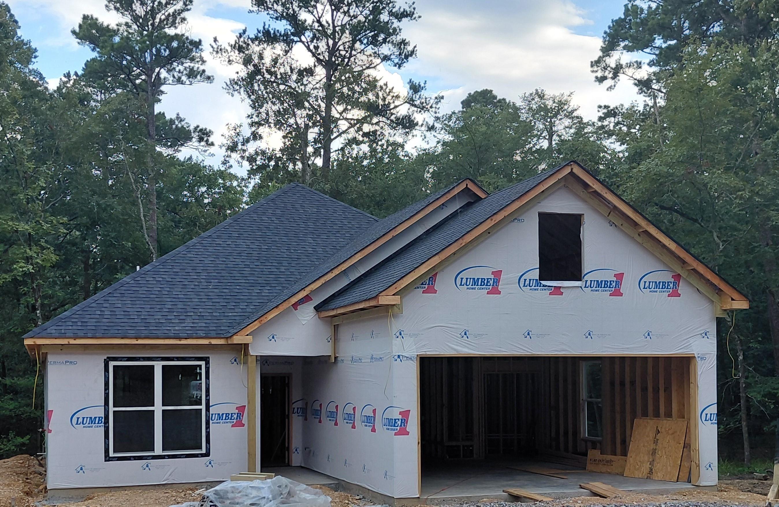 Hard to find New construction under $300,000. This carefully thought out floorplan is perfect for any buyer looking for low maintenance. Features include a Brick and  Vinyl Board and Batten exterior. A lovely covered porch that stretches  across the back of the home, allowing for maximum enjoyment and privacy of your wooded  lot. The interior has a nice flow with luxury vinyl floors throughout. Custom wood Cabinets with soft close, LG appliances and Quartz countertops. 240Sq feet Bonus space (not included in current  sq. footage) perfect for extra storage or future man cave/ craft space or Grandchild dormitory or even a golf simulator, you decide!! Already has electric and prepped for a mini split. If desired can be built out for you. Expected completion late August/early September. Call for colors and tour.