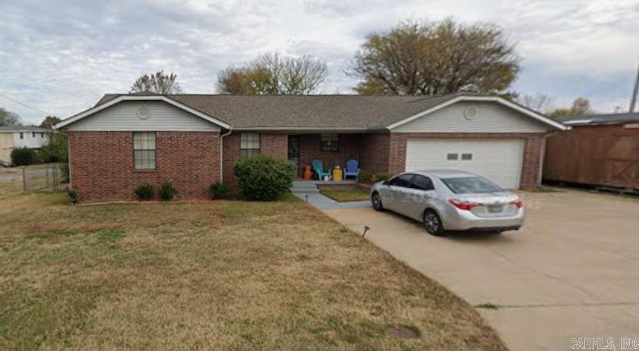 Spacious ranch style all brick 3 bedroom, 2 bath house on 2 large fenced lots. The home is located in the College Station neighborhood and features an updated roof, large rear deck and a large shop that has multiple uses. The building has it's own separate elec. meter. The refrigerator and washer & dryer do convey. Property is being sold "As Is". Shown by appointment only. Agent check remarks