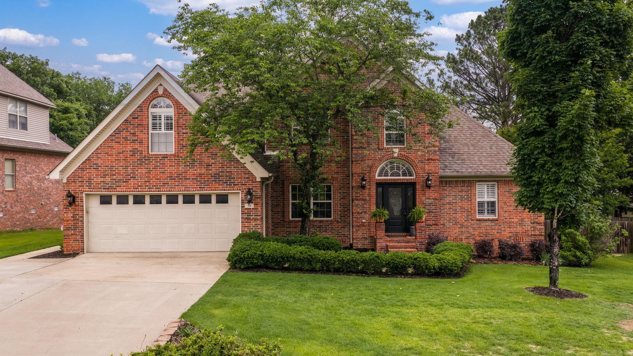 This home features 4 bedrooms, 3 full baths, a formal dining room, and upstairs office area. The inviting living room provides plenty of space for entertaining, while the remodeled kitchen features a built-in coffee bar, walk-through pantry, tons of cabinetry, quartz countertops, a professional-grade gas stove with double ovens, skylights, wood beams and Italian brick floors and new dishwasher. Downstairs, you will find the primary suite includes a spacious walk-in closet with custom built-in shelving, a walk-in shower, and soaking tub. Upstairs, you’ll find exceptionally large bedrooms with oversized closets, a convenient Jack-and-Jill bathroom and a dedicated office space with a built-in desk and cabinetry. Additional interior features include a spacious laundry room offering outdoor access, two sets of French doors and plantation shutters throughout. Step outside and experience an entertainer’s dream. The immediate back patio features a deck with a Hot tub that conveys with the home. Beautiful stone walkways lead to an outdoor living area complete with a wood-burning fireplace, wood-fired pizza oven and professional landscaping. Schedule your showing today.