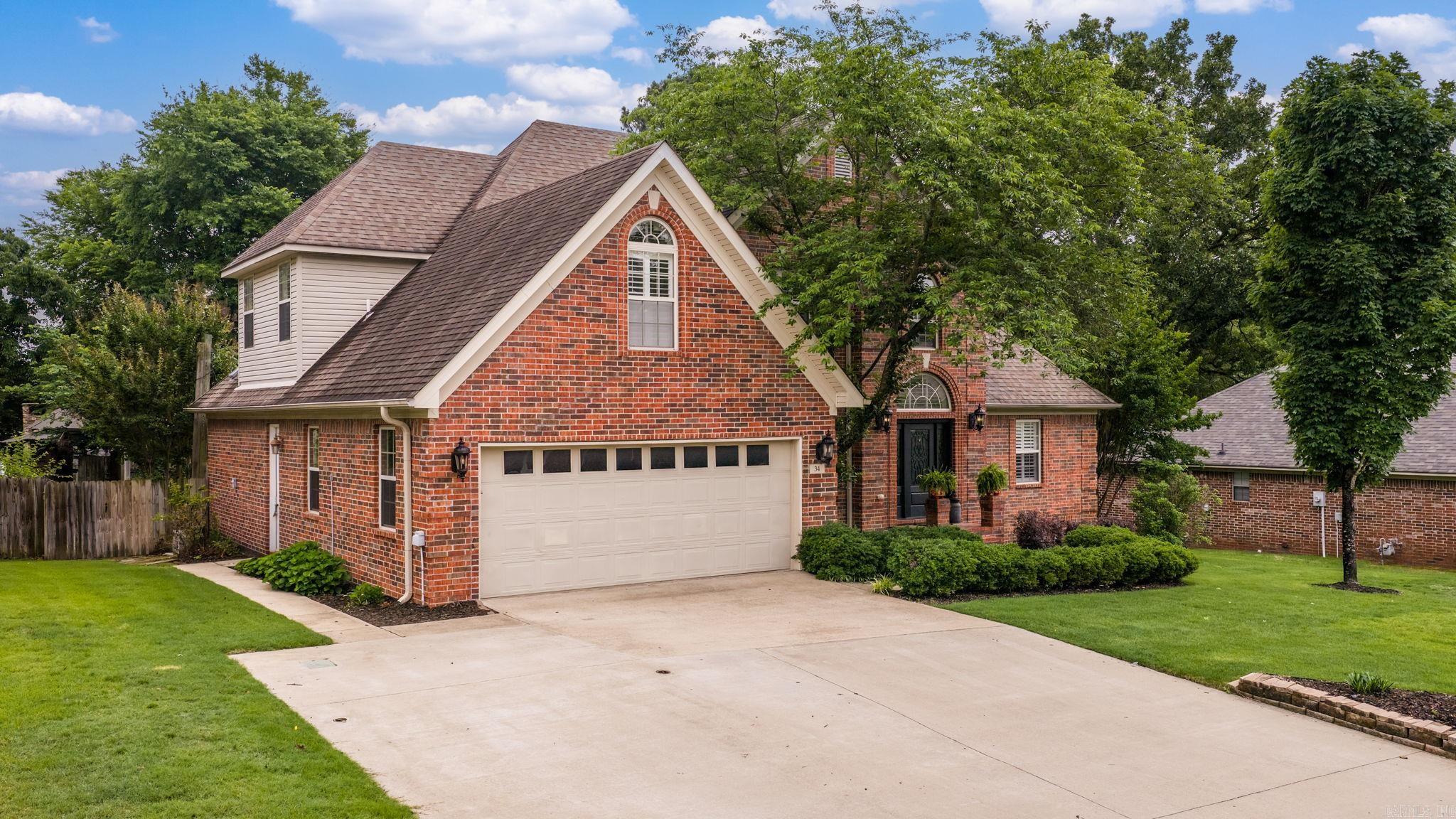 This home features 4 bedrooms, 3 full baths, a formal dining room, and upstairs office area. The inviting living room provides plenty of space for entertaining, while the remodeled kitchen features a built-in coffee bar, walk-through pantry, tons of cabinetry, quartz countertops, a professional-grade gas stove with double ovens, skylights, wood beams and Italian brick floors and new dishwasher. Downstairs, you will find the primary suite includes a spacious walk-in closet with custom built-in shelving, a walk-in shower, and soaking tub. Upstairs, you’ll find exceptionally large bedrooms with oversized closets, a convenient Jack-and-Jill bathroom and a dedicated office space with a built-in desk and cabinetry. Additional interior features include a spacious laundry room offering outdoor access, two sets of French doors and plantation shutters throughout. Step outside and experience an entertainer’s dream. The immediate back patio features a deck with a Hot tub that conveys with the home. Beautiful stone walkways lead to an outdoor living area complete with a wood-burning fireplace, wood-fired pizza oven and professional landscaping. Schedule your showing today.