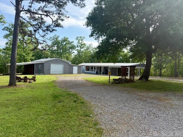 PEACEFUL LAKE OUACHITA LIVING!! 6.8 ACRES LESS THAN 1/2 MILE FROM THE IRON FORK LAUNCHING RAMP ON LAKE OUACHITA! This charming property is as serene as it comes! Bring all your toys and your dog, too! Come enjoy living your best life! This 3 bedroom 2 bath home has an inviting covered front porch perfect for tea sipping and a covered back deck perfect for whitetail and turkey watching! All of this and it backs up to US FORESTRY LAND FOR PUBLIC HUNTING! Grandpa will love the detached shop with room to store all the toys and and a fully functioning apartment-man-cave! Just a few feet over is a carport to store the boat or motorhome! This property WILL NOT LAST! MOTIVATED SELLER!! CALL ME TODAY TO SCHEDULE YOUR SHOWING!