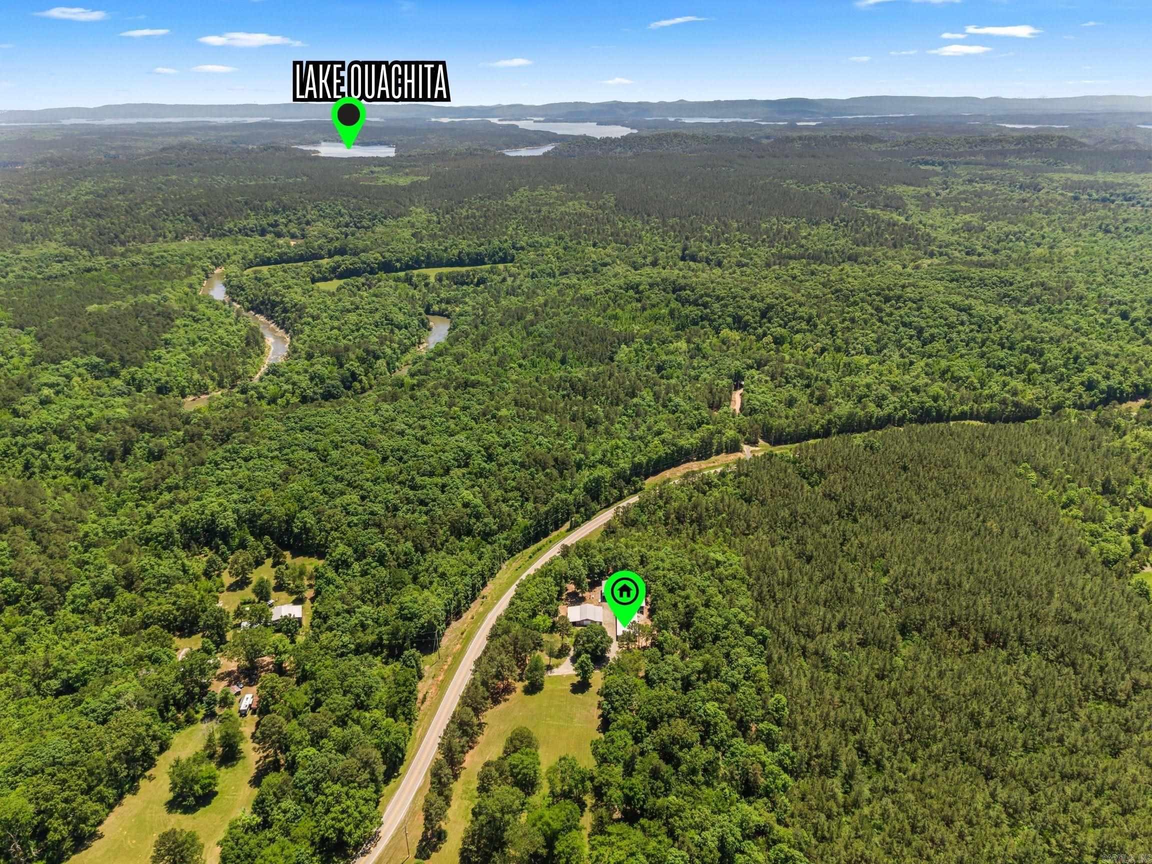 MOTIVATED SELLER! PRICE REDUCED!!  PEACEFUL LAKE OUACHITA LIVING!! 6.8 ACRES LESS THAN 1/2 MILE FROM THE IRON FORK LAUNCHING RAMP ON LAKE OUACHITA! This charming property is as serene as it comes! Bring all your toys and your dog, too! Come enjoy living your best life! This 3 bedroom 2 bath home has an inviting covered front porch perfect for tea sipping and a covered back deck perfect for whitetail and turkey watching! All of this and it backs up to US FORESTRY LAND FOR PUBLIC HUNTING! Grandpa will love the detached shop with room to store all the toys and and a fully functioning apartment-man-cave! Just a few feet over is a carport to store the boat or motorhome! This property WILL NOT LAST! MOTIVATED SELLER!! CALL ME TODAY TO SCHEDULE YOUR SHOWING!