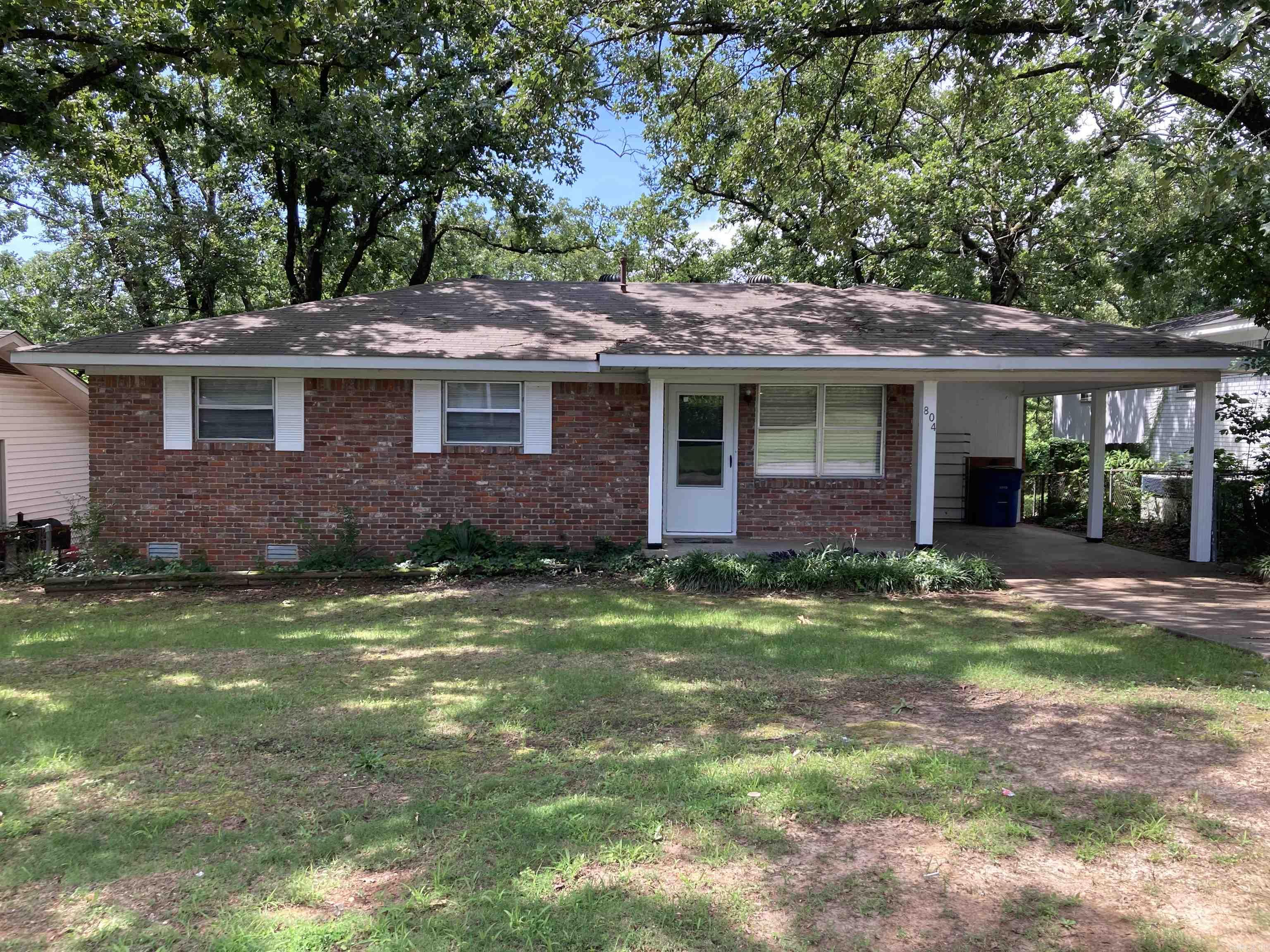 Great starter home w/ lots of updates in convenient location!  Beautiful, refinished hardwoods in living room and hallway.  Tiled kitchen w/ lots of stained cabinety.  Laundry nook off kitchen.  Ceramic tiled bath.  New carpet in all bedrooms, fresh paint all through the home.  Brick exterior with metal soffit/ fascia.  Single carport, plus extra parking pad.  Recent energy audit/ R38 insulation blown in attic.  Brand new deck to enjoy fenced, shaded backyard.