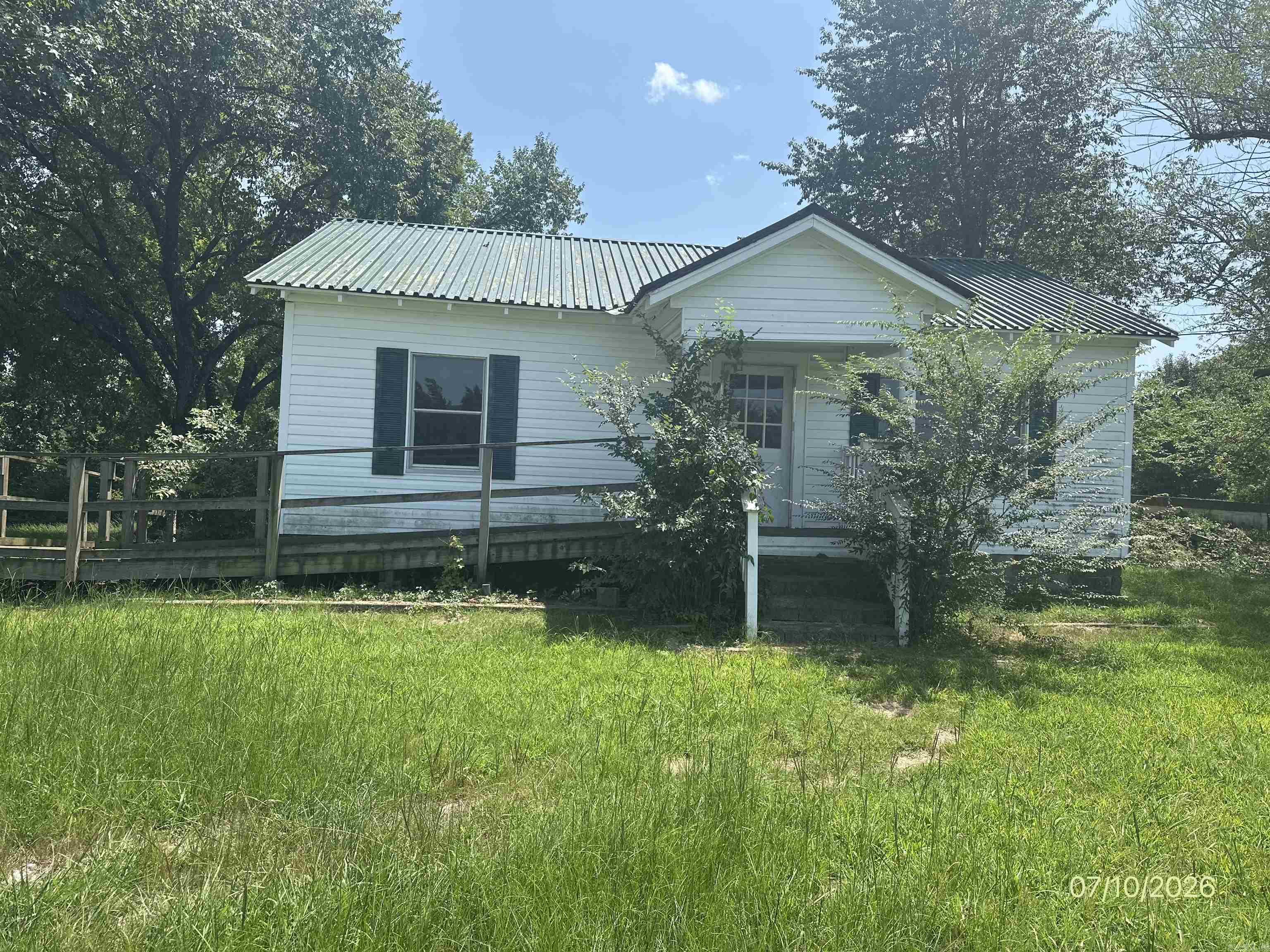 Cute little country house looking for people to make it into a home. So much potential in this 2 bedroom, 1 bath home. It has an attached storm shelter that is accessed from inside the house. There is a wheelchair ramp on the front for easy access. There is no water heater or stove, but it could be easily move in ready. This is a foreclosure and seller will not pay customary title policy, escrow fees, survey or transfer fees. POF or Pre-Qual letter dated 30 days or less required with offer. All offers must be submitted at www.vrmproperties.com. Agents must register as a user, enter the property address, and click on start offer.