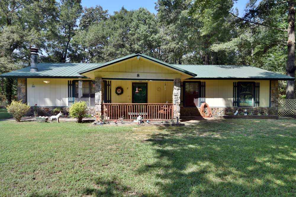 Listen to the sound of pitter patter on the new metal roof of this 1/2 acre charmer just outside city limits.  Mechanics have been updated and she needs a new owner.  You'll love the mature trees that are perfect shade to help keep those utilities down. Wonderful schools. And on a private road that backs up to acres of  trees and pasture for a private feel as you sit in your screened back porch.  100% RD Financing Eligible. Call to see this one before its gone!