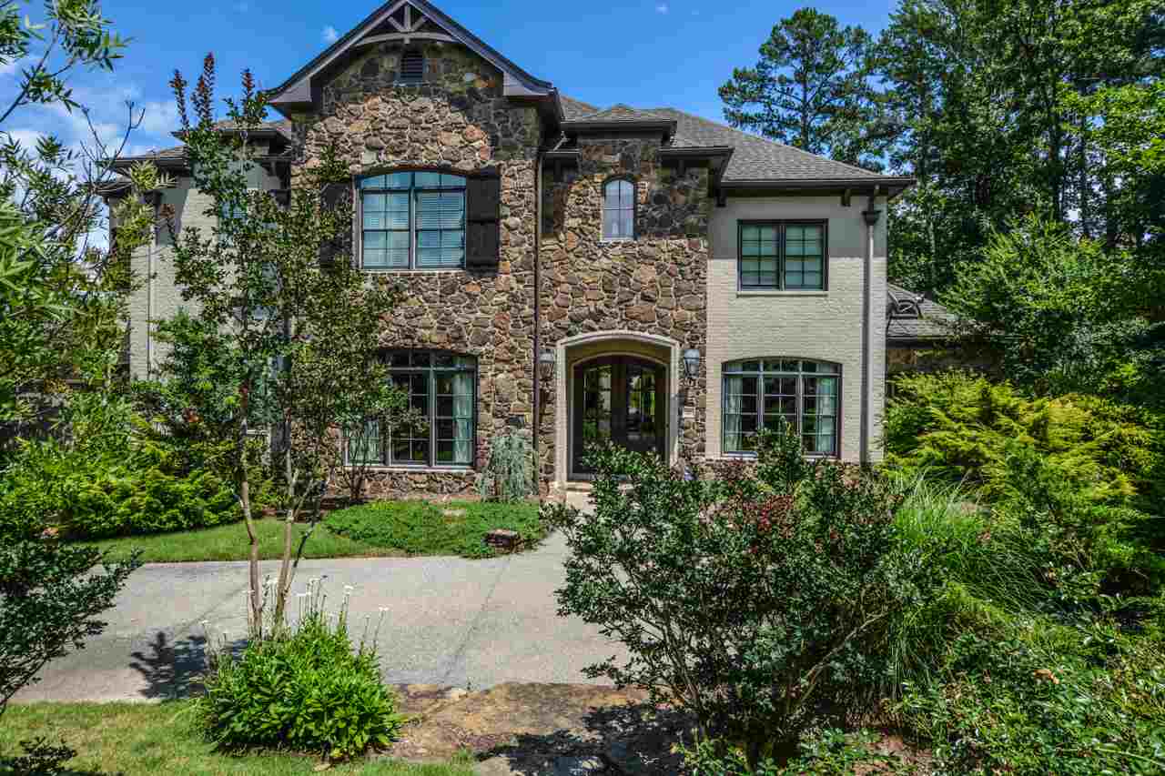 This elegant estate in Chenal Valley at the Maisons will capture your heart with its stylish features and luxurious landscaping. Almost 6,200 sf of living space coupled with a beautiful circle drive that leads through a porte-chochere to both garages, surrounded by mounds of mature trees and flowering shrubbery, beautiful natural Arkansas boulders, iron fencing, and a serene koi pond make this one a highly sought after residence.  The home offers 5 bedrooms, 4 bathrooms plus 2 half baths, & much more.
