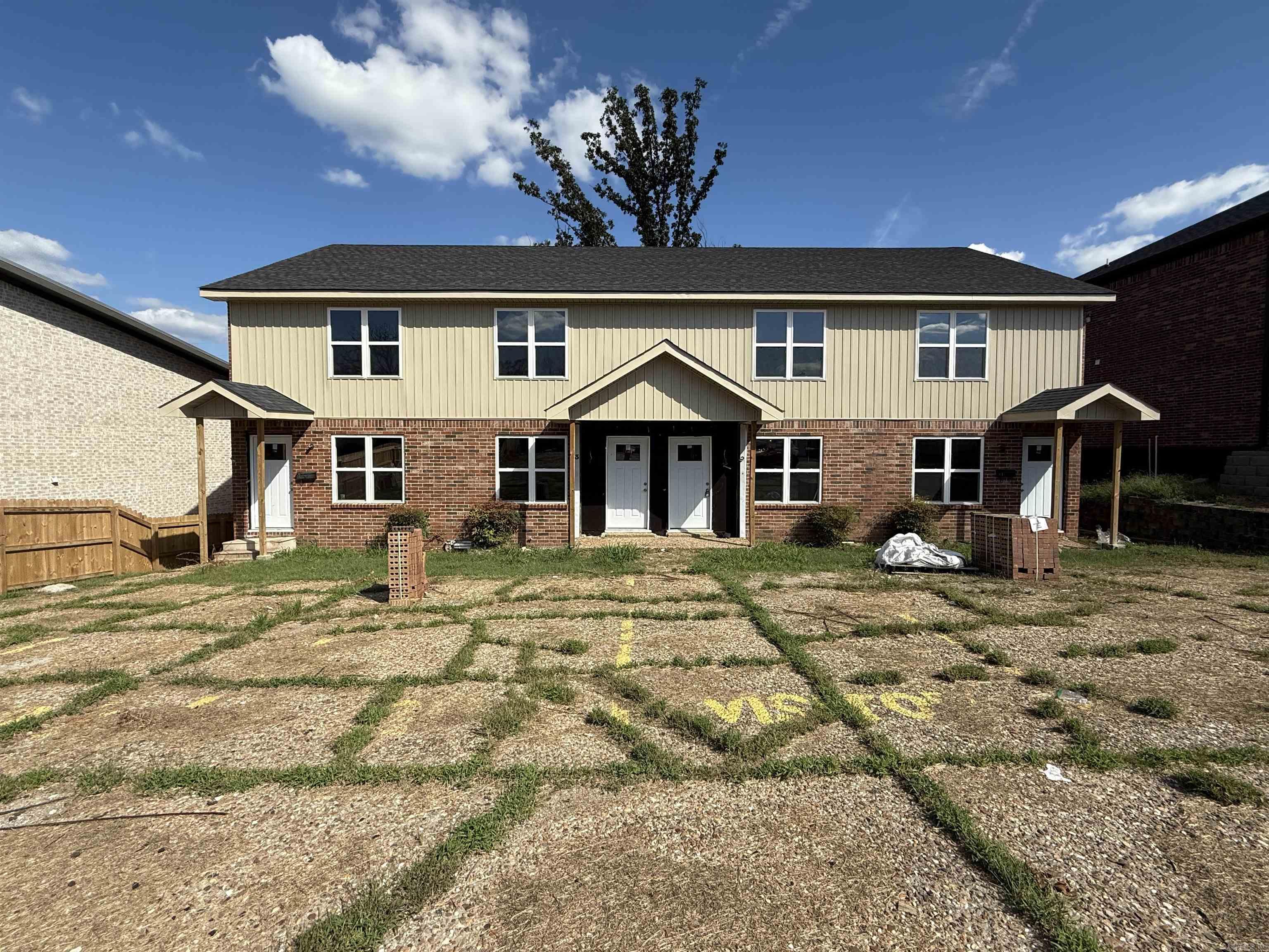 This 4-unit townhouse building presents a compelling AS-IS sale opportunity for investors or developers seeking to capitalize on the current market. Originally damaged by the March 2023 tornado, the property has undergone some renovations by the current owner, including full reframing, new siding and brickwork, a replaced roof, updated windows and doors, newly constructed back decks, fencing, and thorough cleanup and removal of tornado debris. A discounted contract is in place for the installation of a sprinkler system, adding further value. With other townhomes in the area already renovated and achieving full rental potential, this property offers a blank canvas for transformation into high-demand rental units or a profitable investment. Current market rents for similar units are approximately $1200 to $1300 per unit. Sold AS IS, WHERE IS, NO PROPERTY DISCLOSURE—this is a rare chance to create lasting value through strategic restoration. SEE PICTURES FOR CURRENT CONDITION OF INSIDE. "See agent remarks"