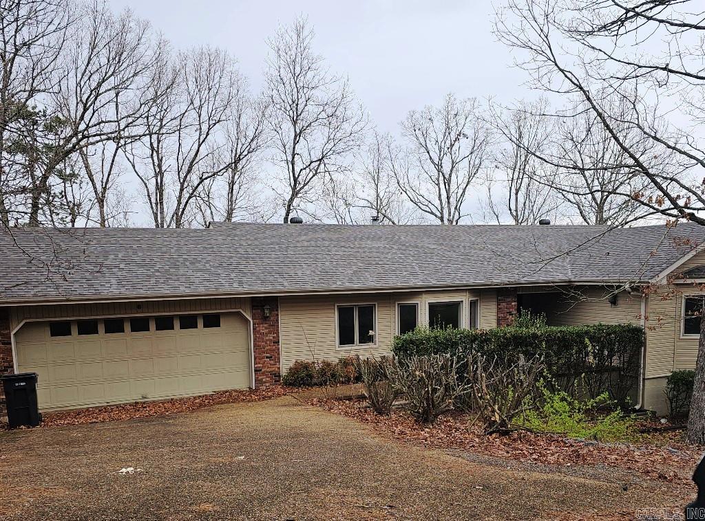 One Level 3 bdrm, 2 Bath home with seasonal view. Fireplace and 2 car garage. Large laundry room. Storage Under Home.