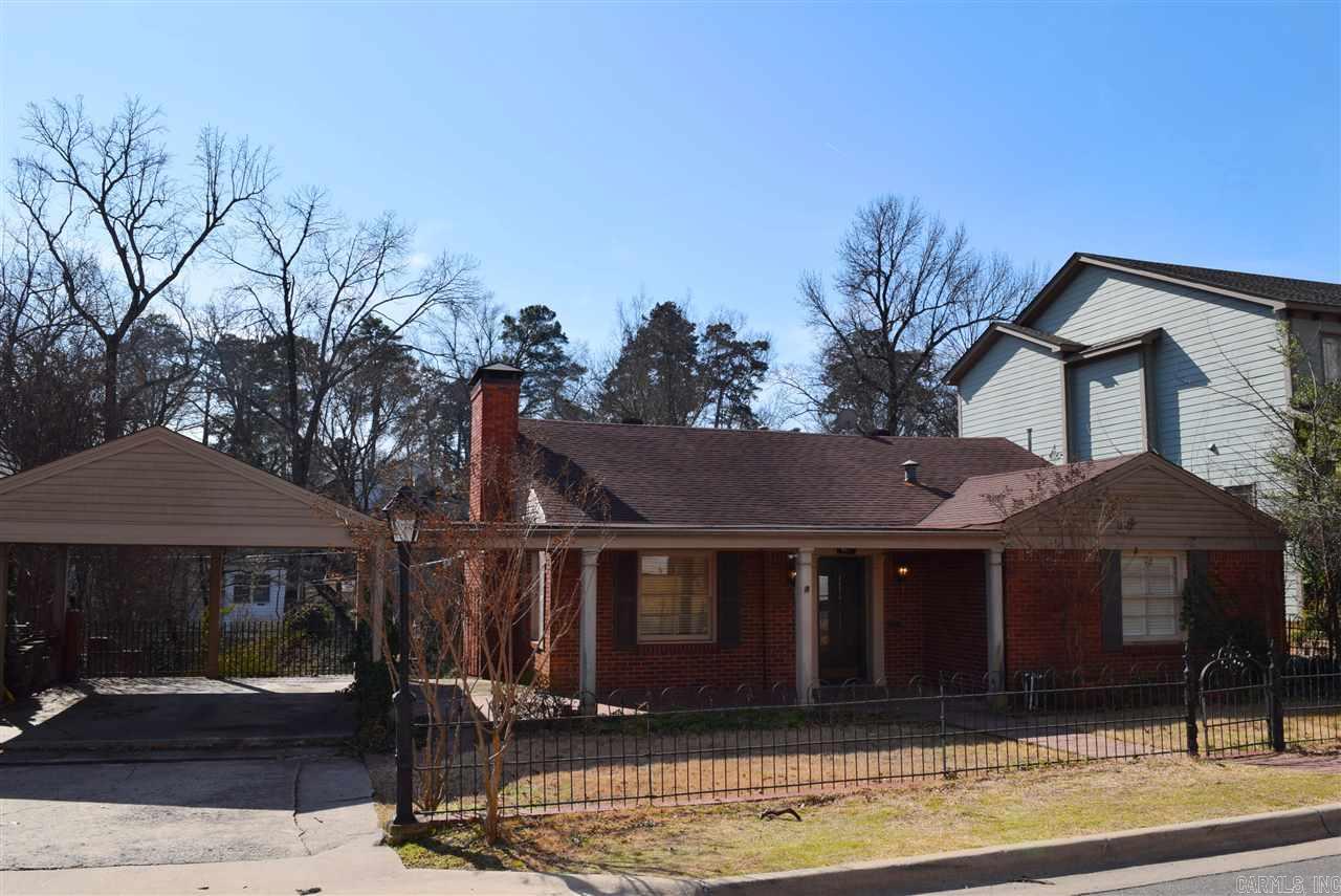 Location, location, location! Walk to Country Club of Little Rock, Heights shopping and restaurants. Mid-century brick, split to the rear w/ nice, wide front porch. Master suite up w/ large  BA & walk-in closet. Spacious living/dining area features hdwd floors, FP - opens to kitchen and overlooks backyard w/ ample windows. 2 BR's & 1BA down plus huge man cave w/ lovely wood cabinetry & FP. Fully covered patio w/ beautiful light fixture & ceiling fans -great for entertaining! Large backyard.
